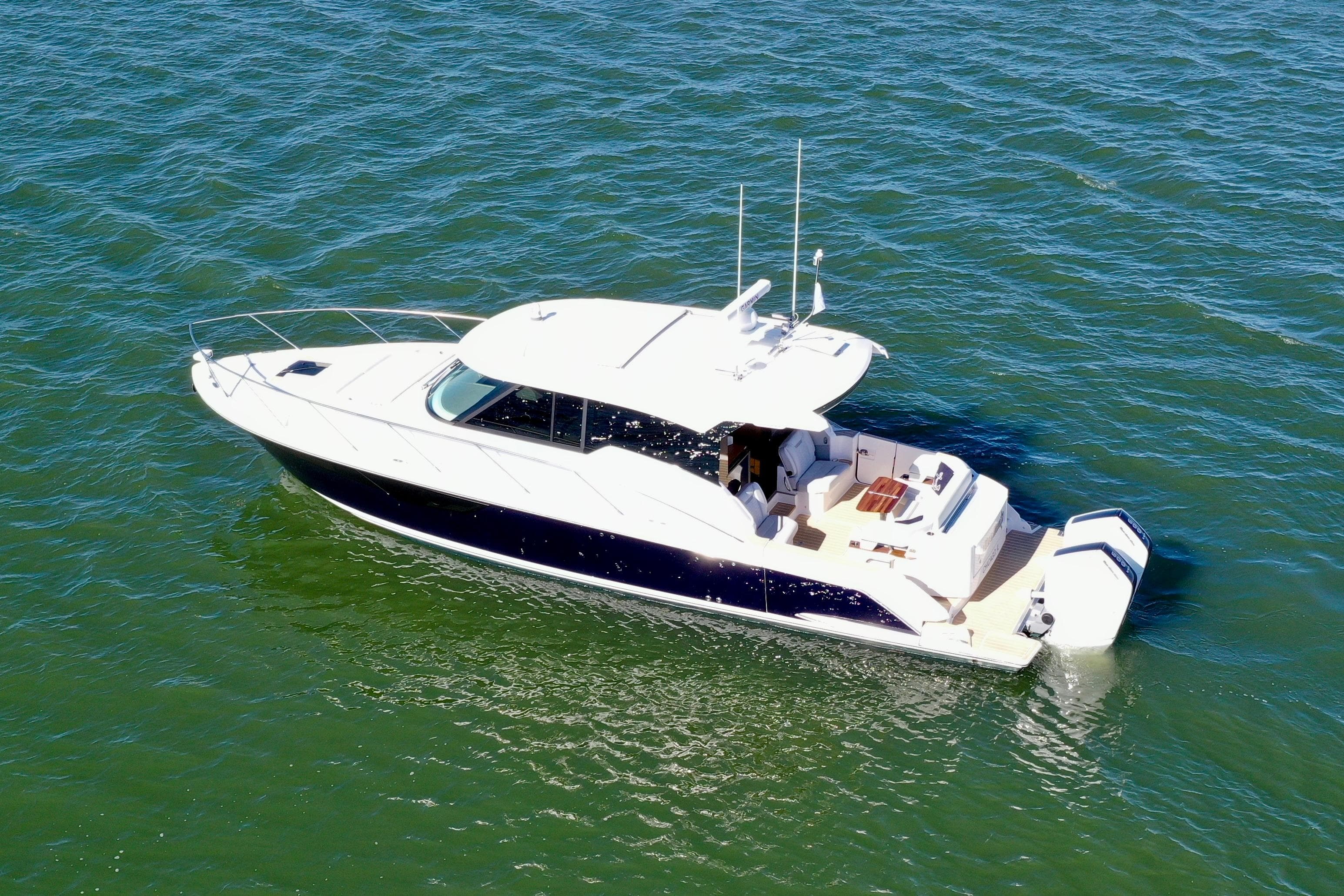 2025 Tiara Yachts 43 LE cruising on open water, showcasing sleek design and luxury features.