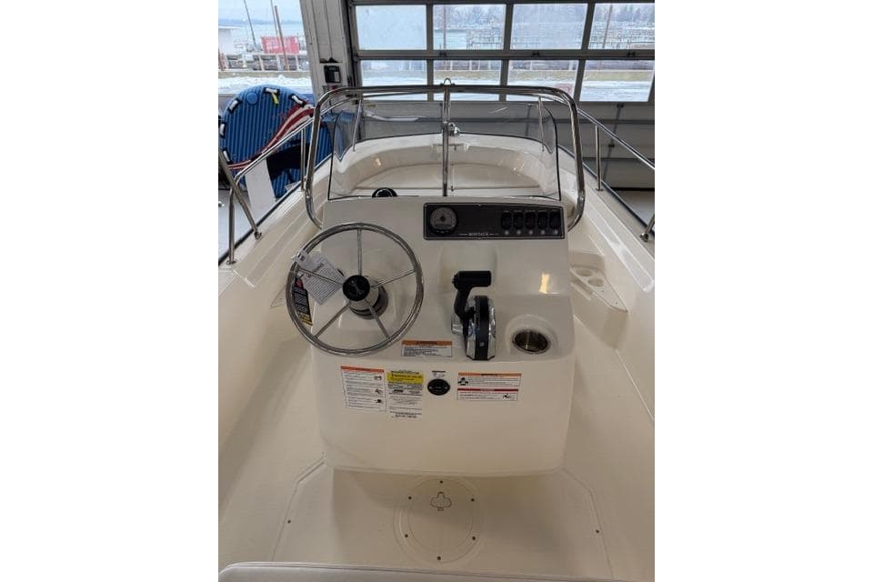 2026 Boston Whaler 170 Montauk boat console with steering wheel and controls.