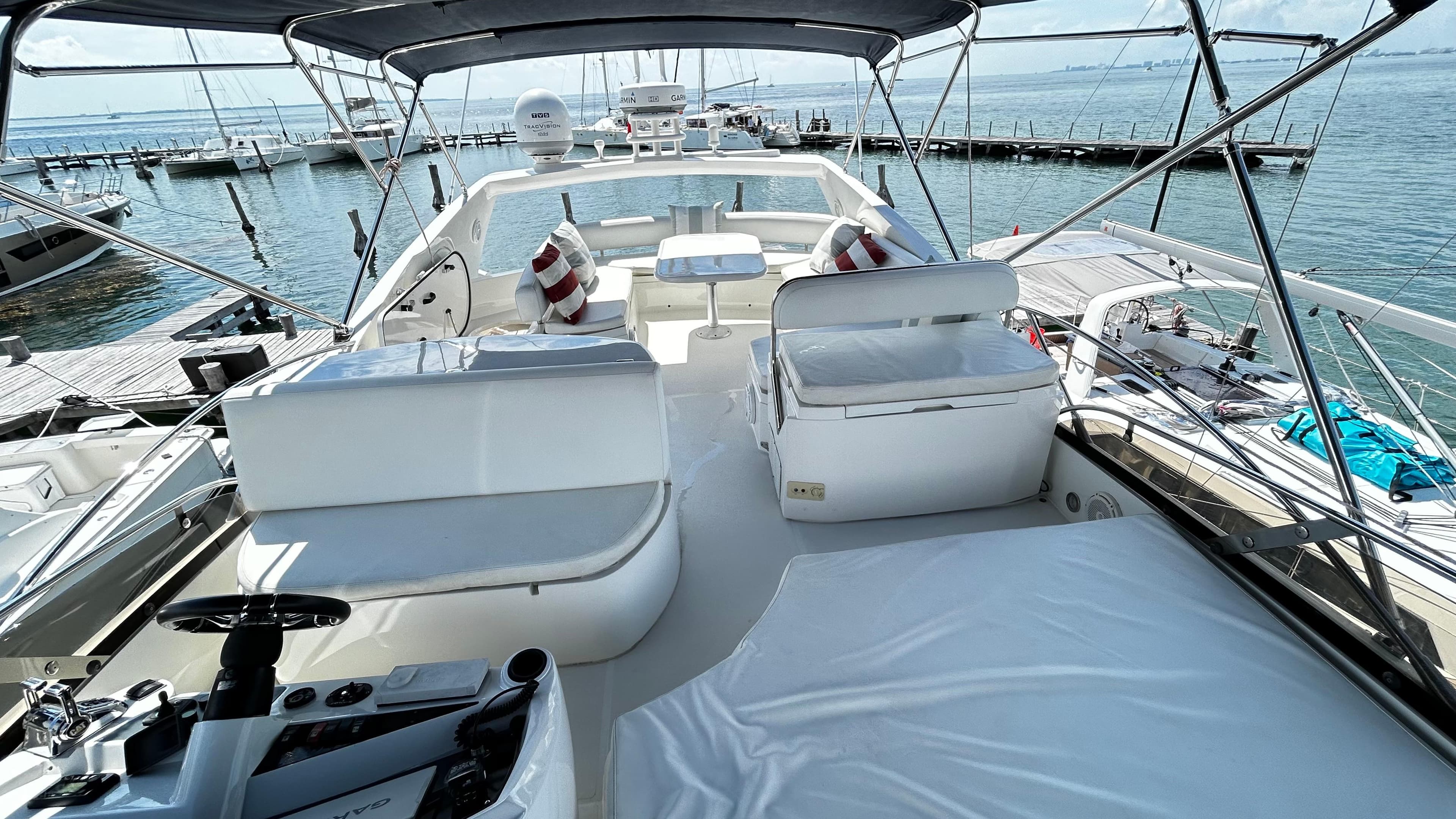 Luxurious 2006 Sunseeker Manhattan 60 yacht interior with spacious seating and ocean view.