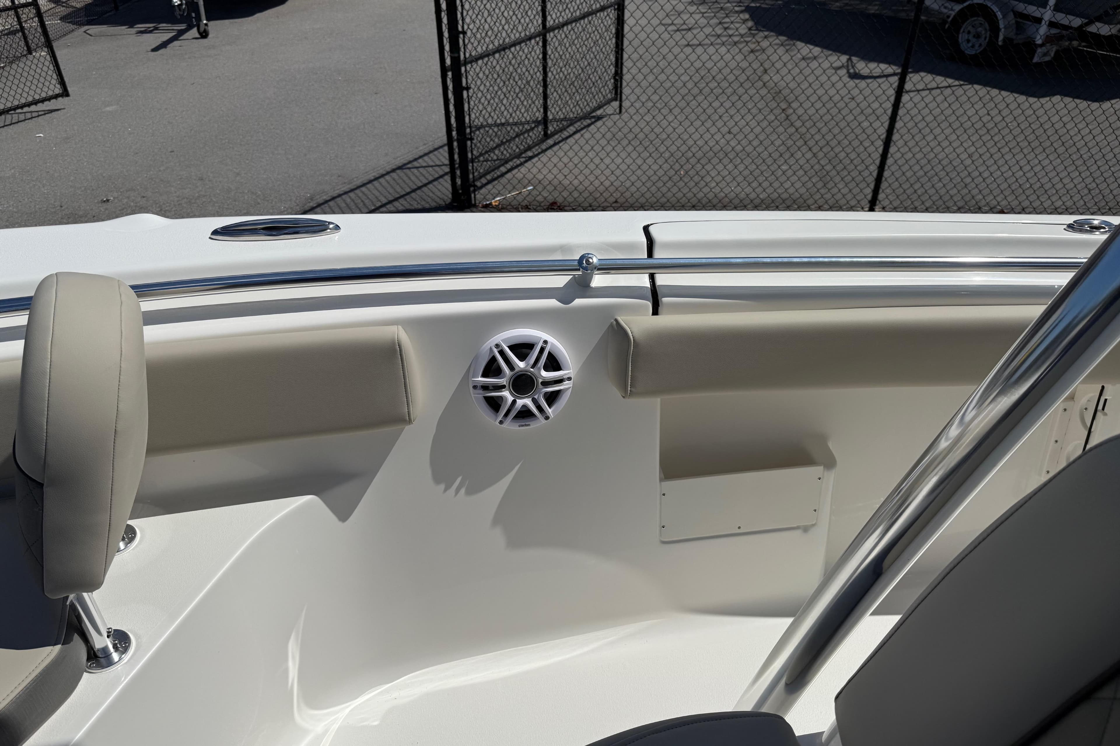 2026 Key West 239 FS boat interior with cushioned seating and speaker system.