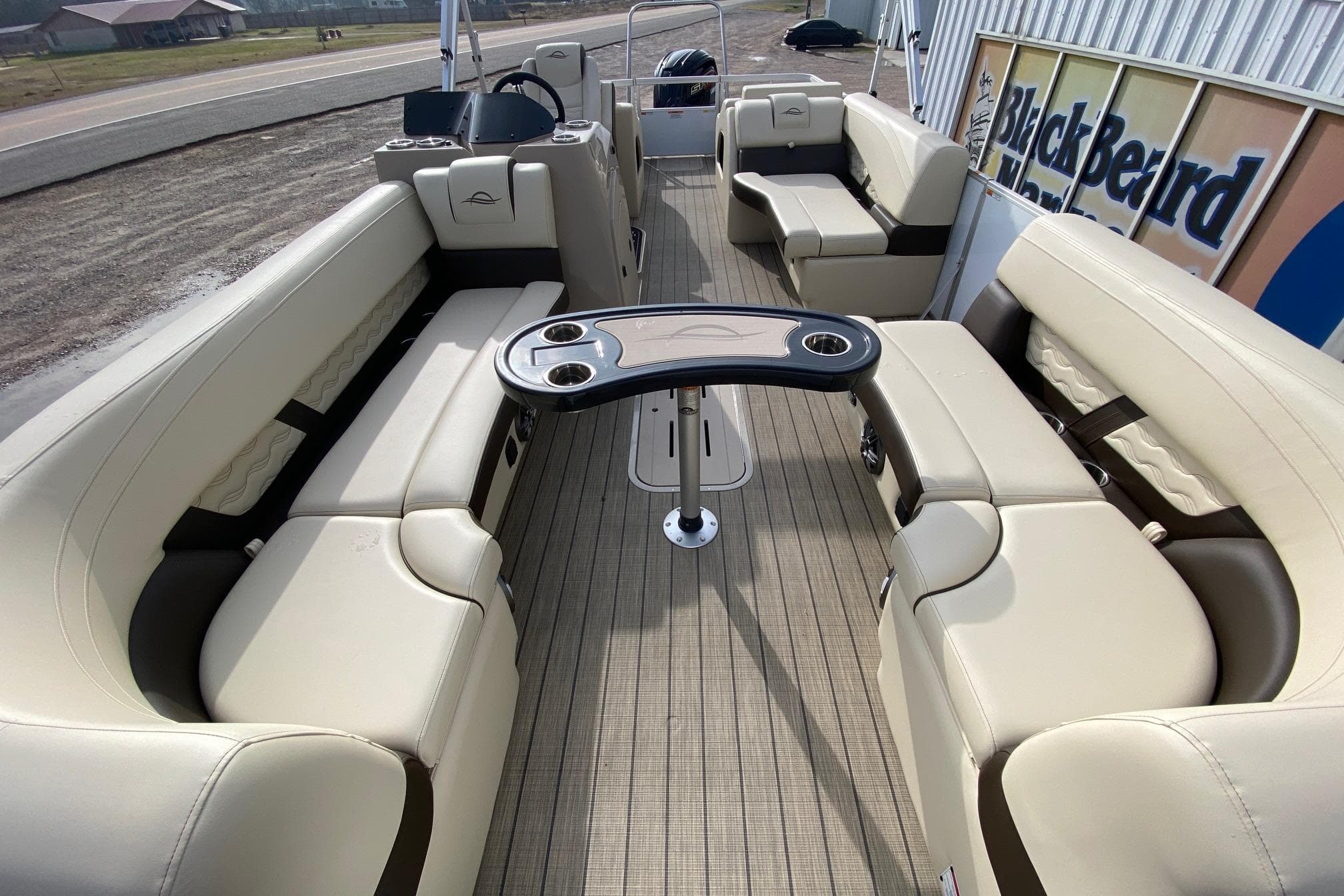 2026 SunCatcher Fusion 324SS pontoon boat with luxurious seating and modern design.