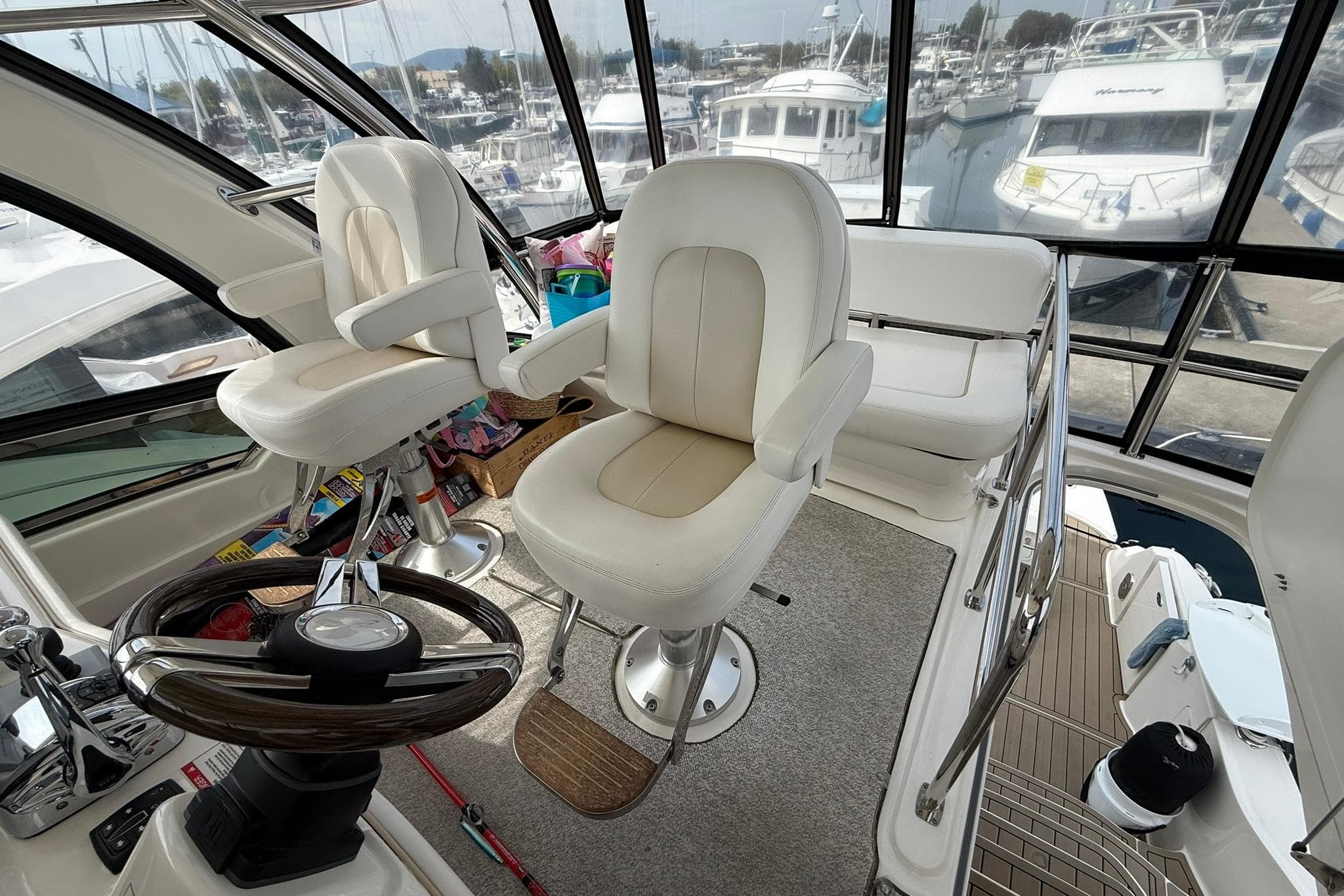 Interior of 2010 Sea Ray 520 Sedan Bridge yacht with helm and seating area.