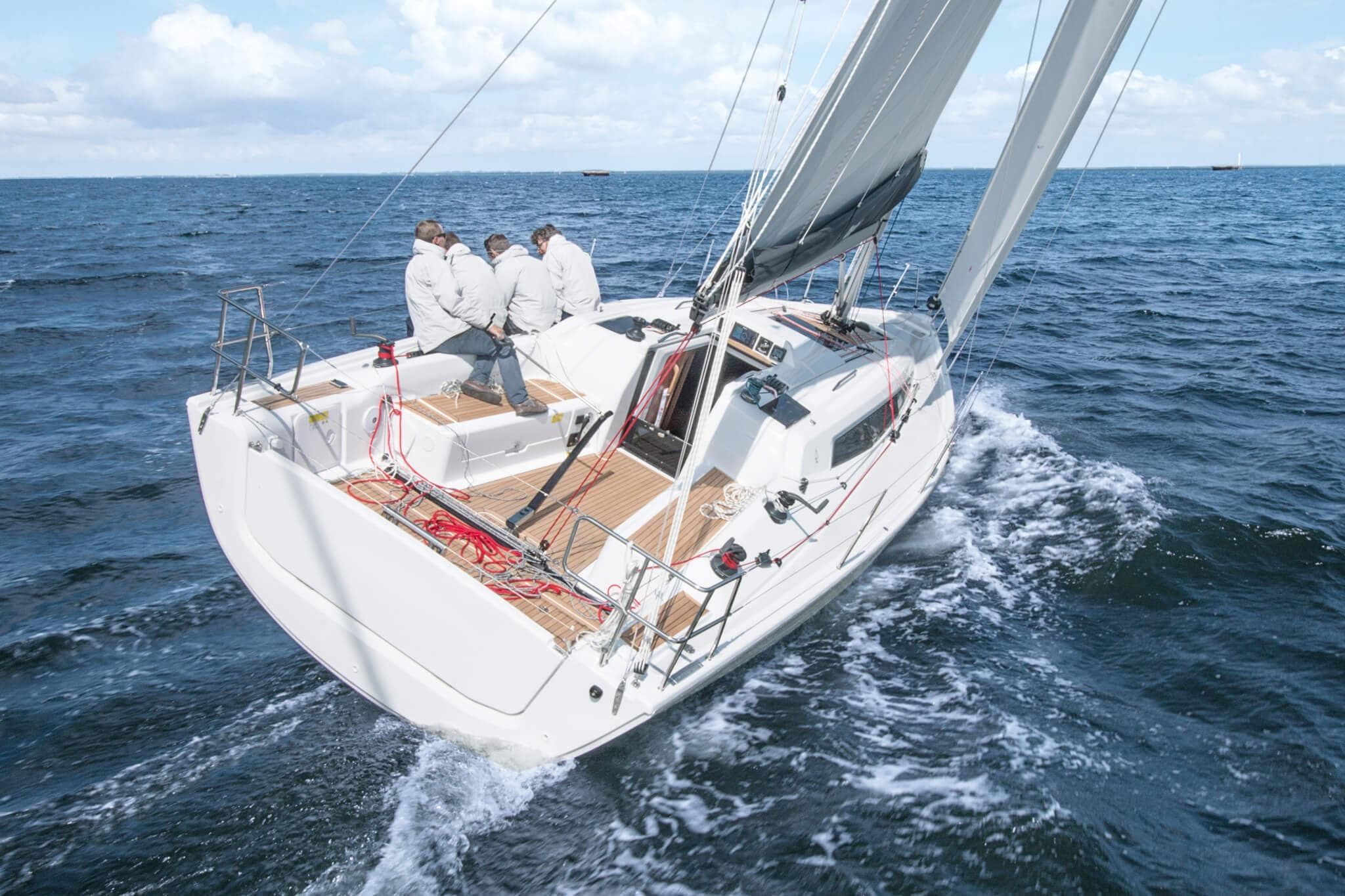 2026 Dehler 34 sailboat navigating ocean waters with crew onboard.