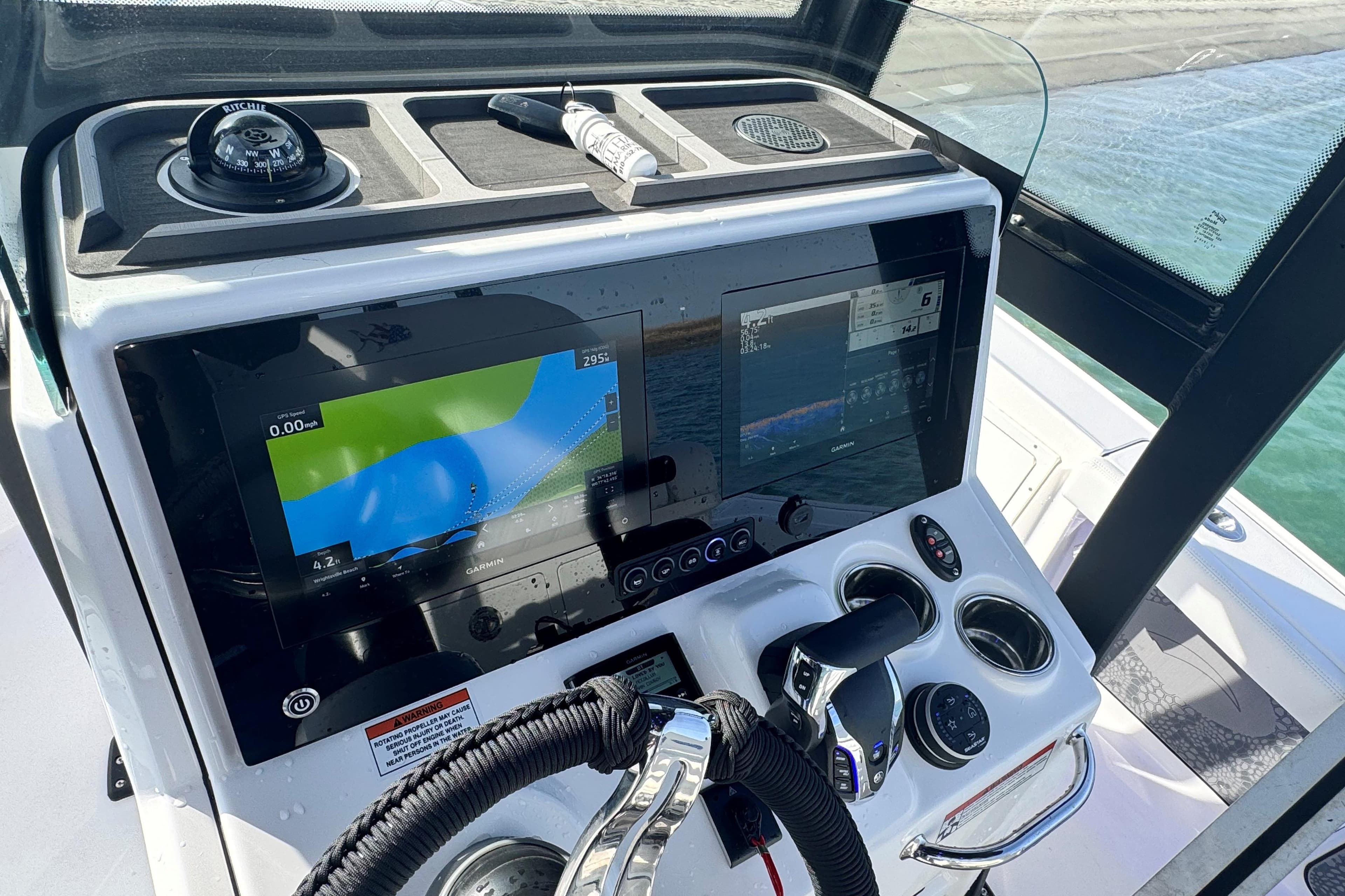 2025 Crevalle 24 HCO boat dashboard with navigation screens and controls.