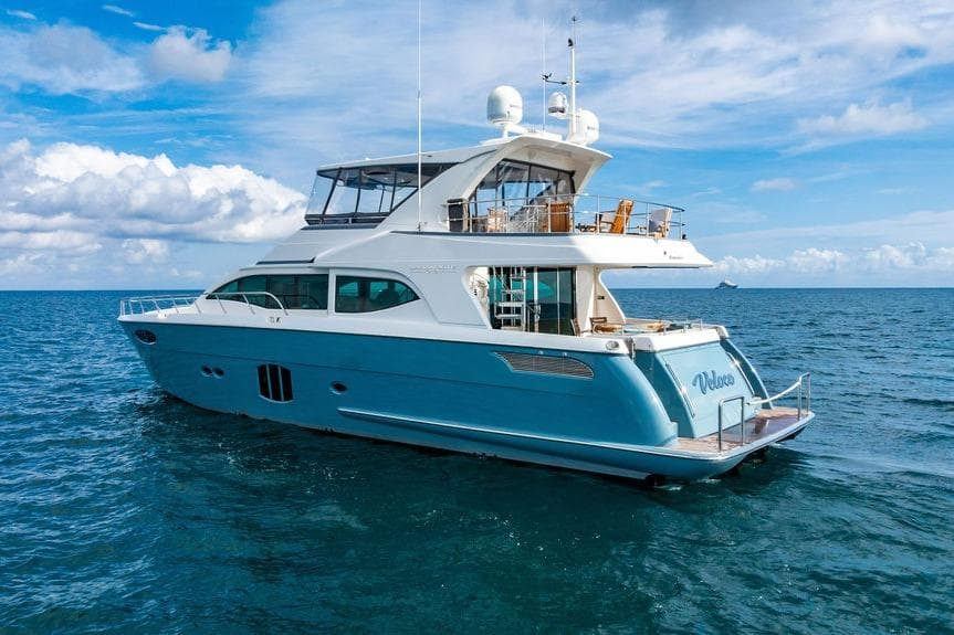Luxurious 2013 Lanzarote Ventuno 73 yacht cruising on open sea under blue sky.