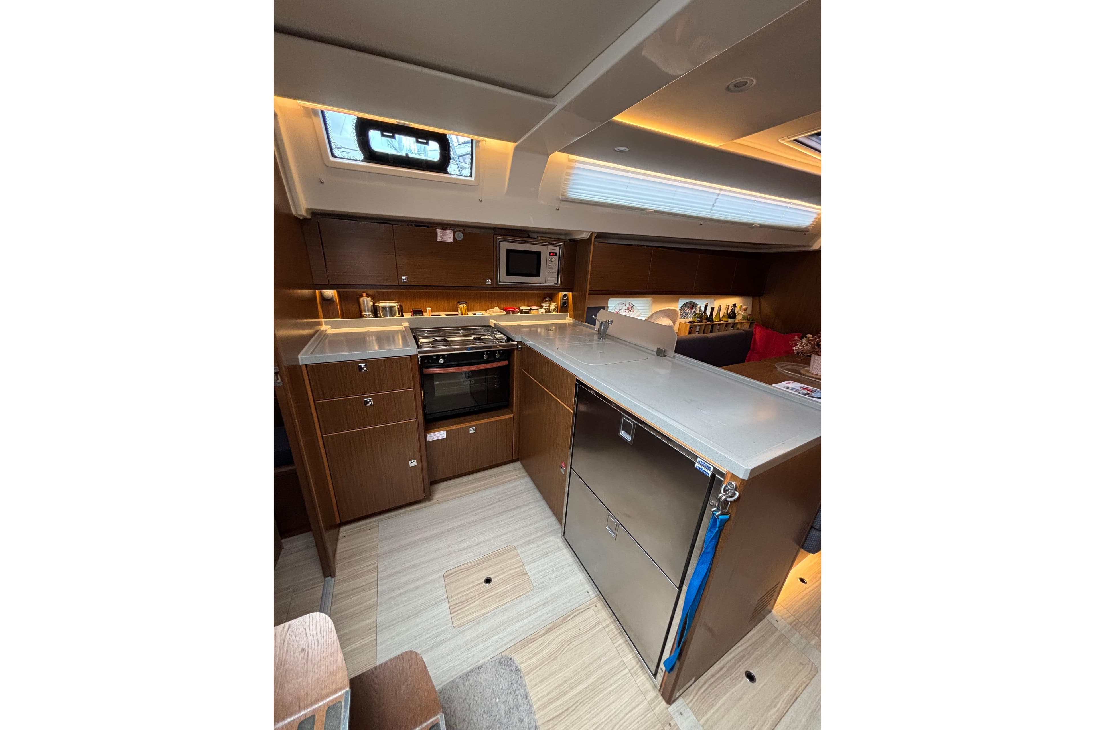 Modern kitchen interior of 2019 Bavaria C45 yacht with sleek cabinetry and appliances.