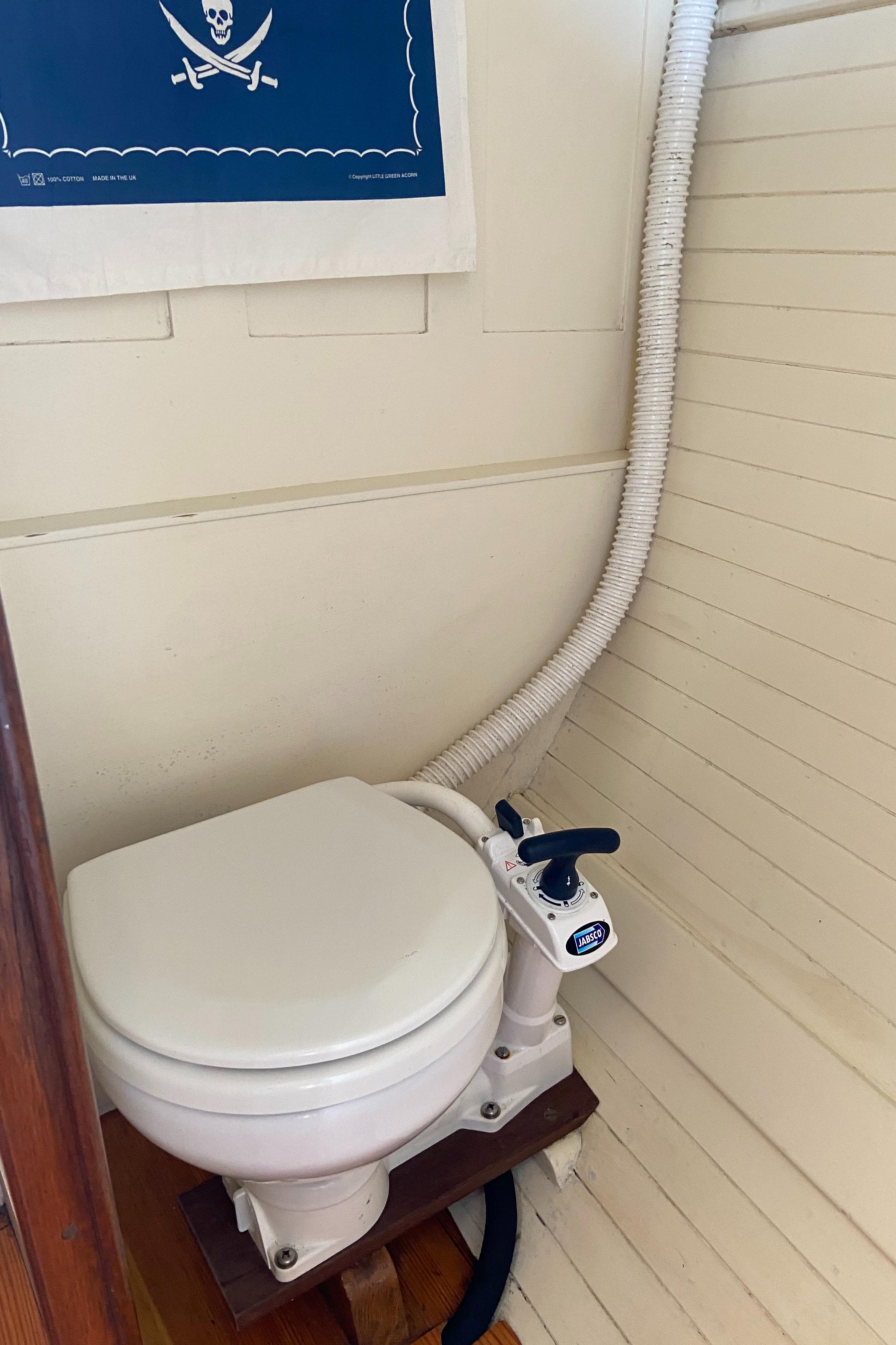 1929 Classic Lobster Cruiser marine toilet with pirate-themed decor.
