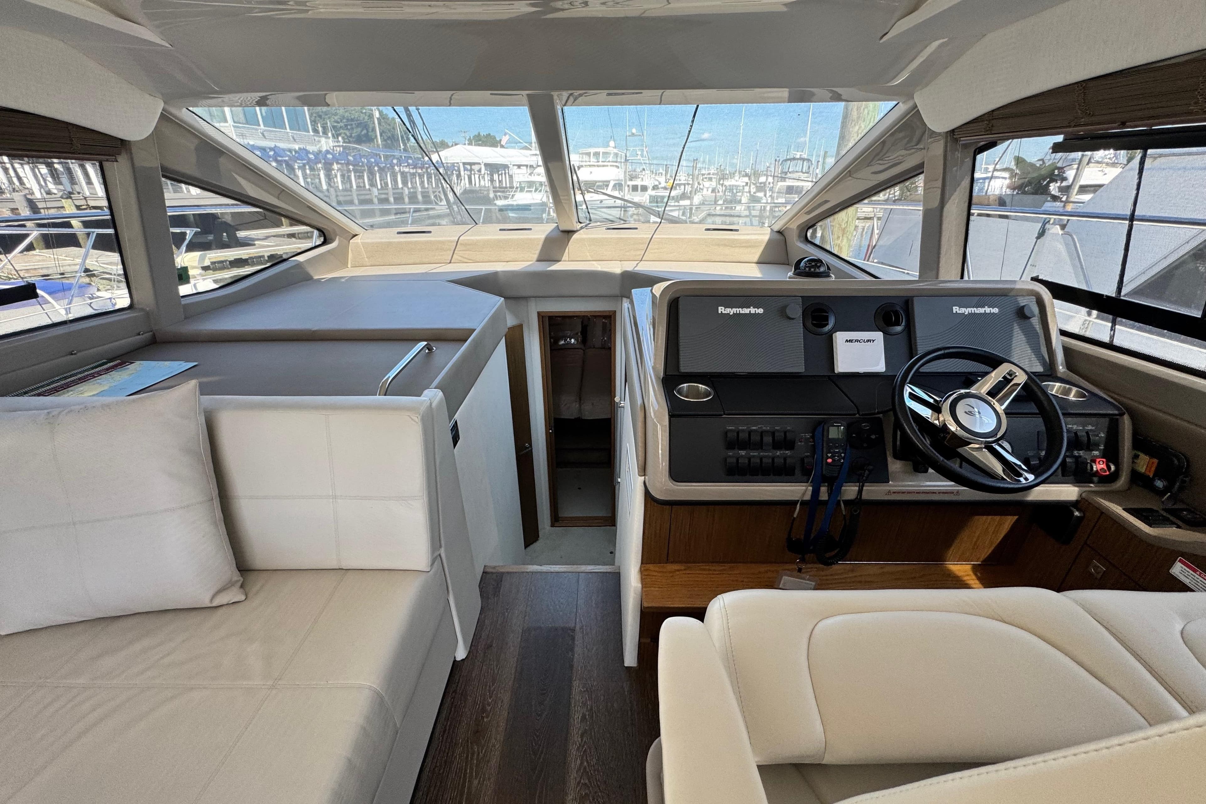 2017 Sea Ray Sundancer 460 helm with modern controls and comfortable seating.