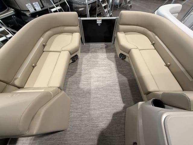 2026 Godfrey Pontoons Xperience 2286 SBX interior with beige seating and carpeted floor.
