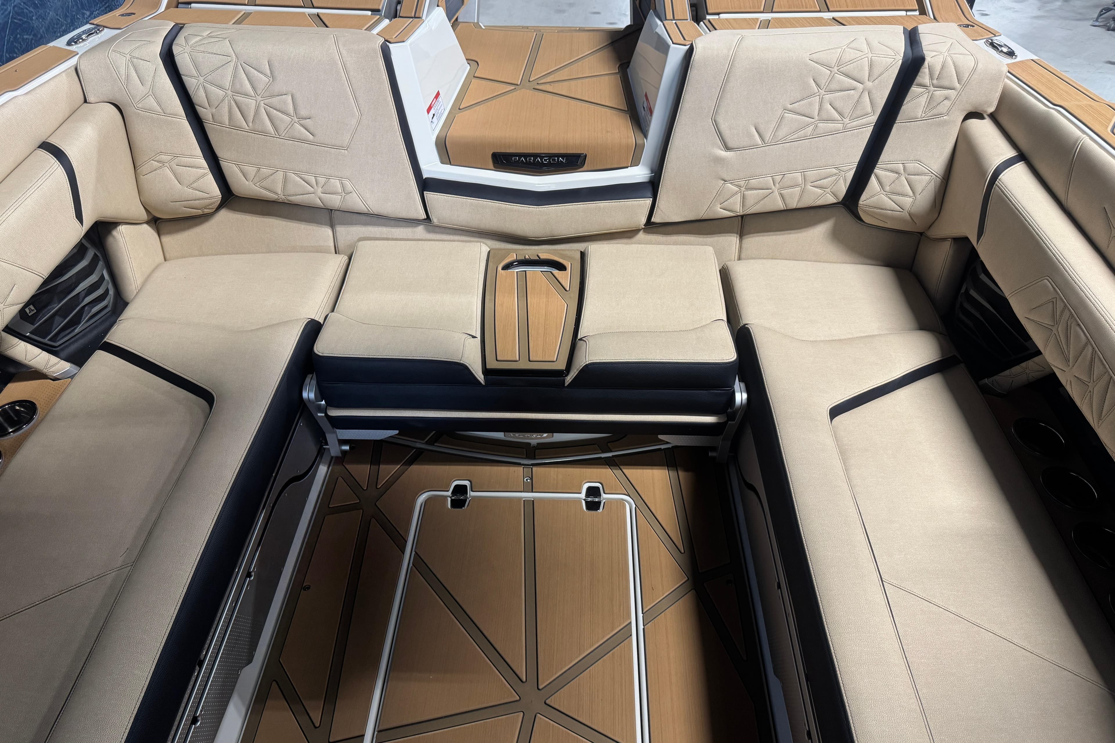 Luxurious interior of 2026 Nautique Super Air Nautique G25 Paragon boat with beige seating.