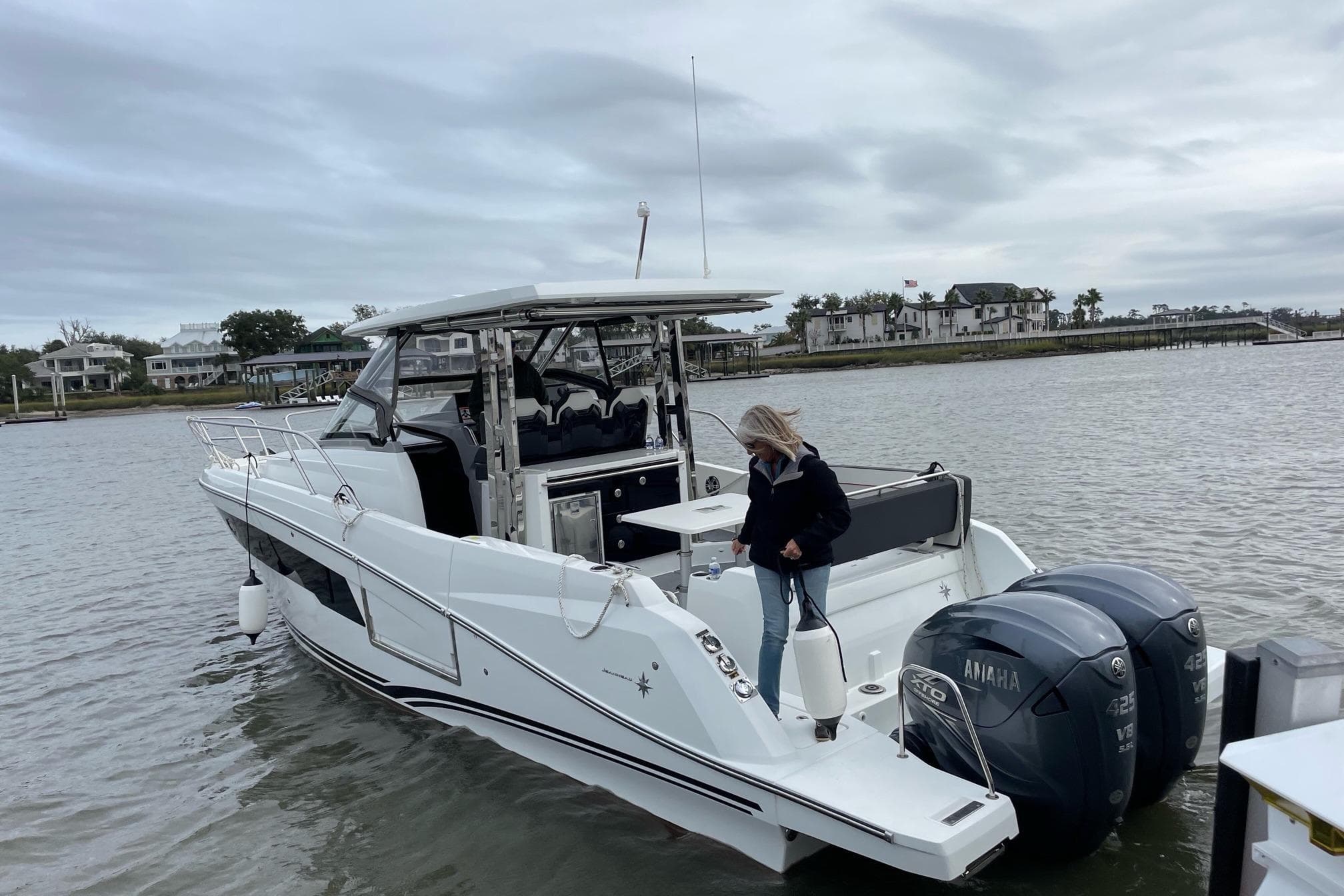 2022 Jeanneau Leader 10.5 WA Series 2 boat with Yamaha engines on a calm waterway.