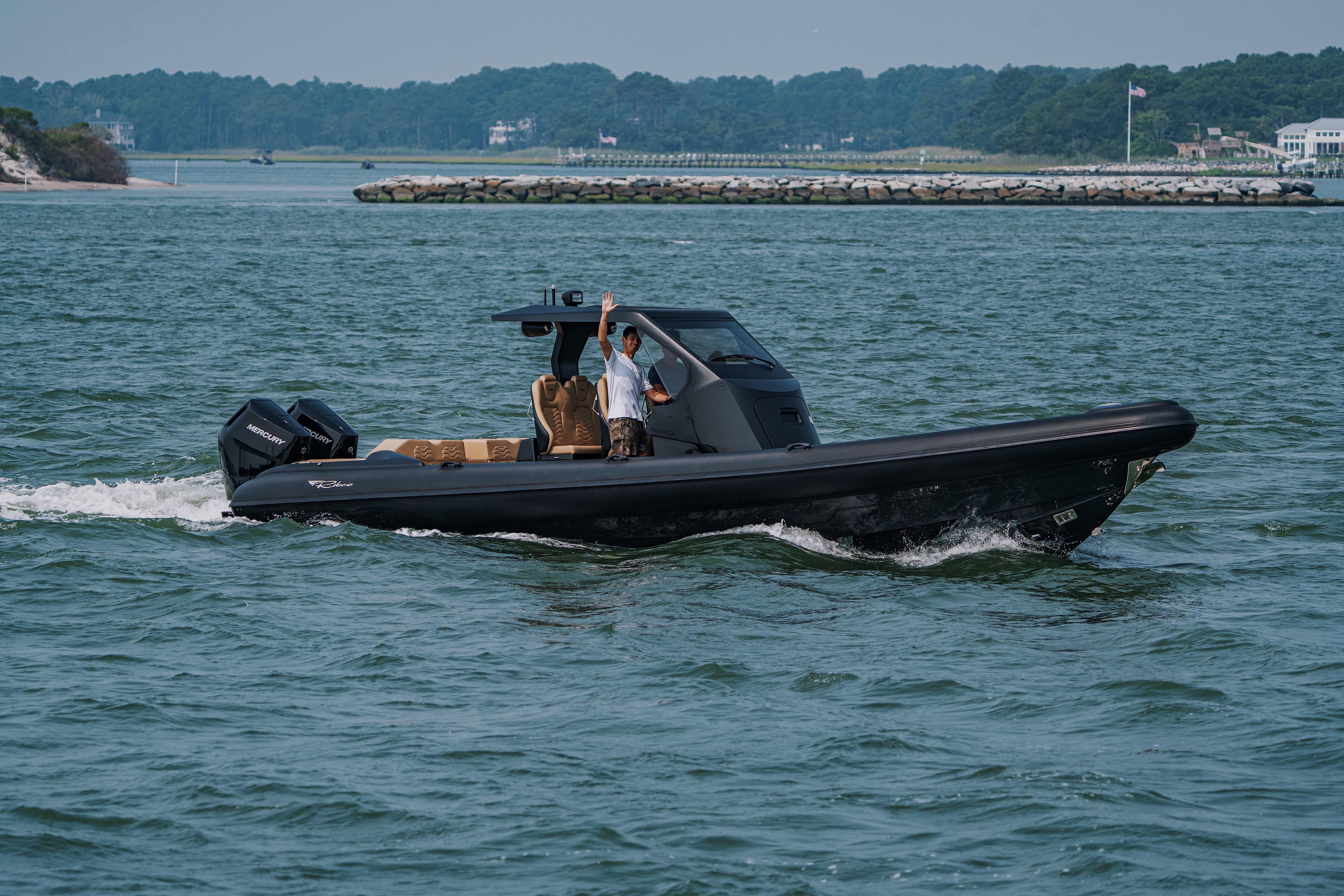 2023 Ribco Seafarer 36 X cruising on open water with dual Mercury engines.