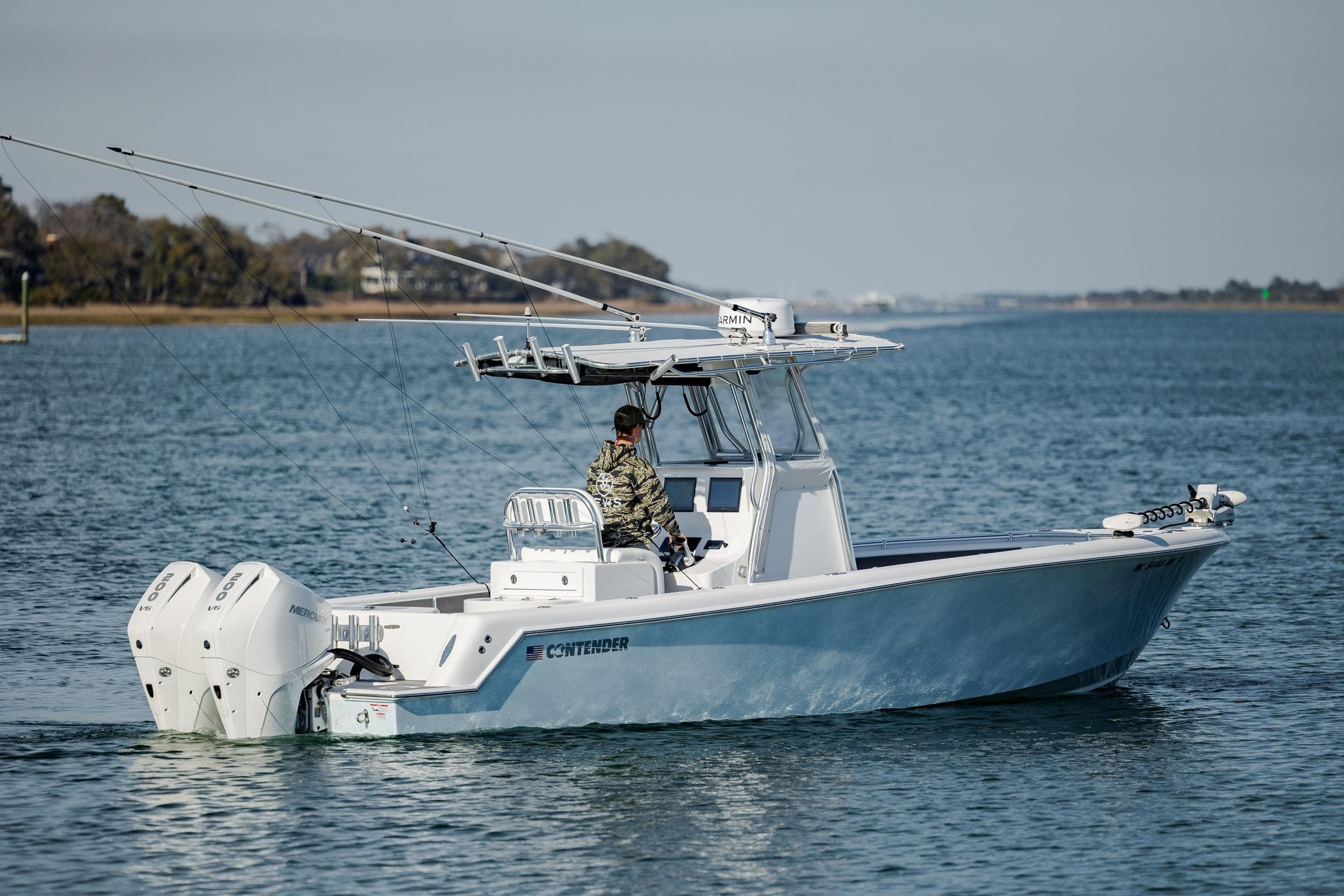 2024 Contender 28 Tournament boat cruising on calm waters with dual engines.