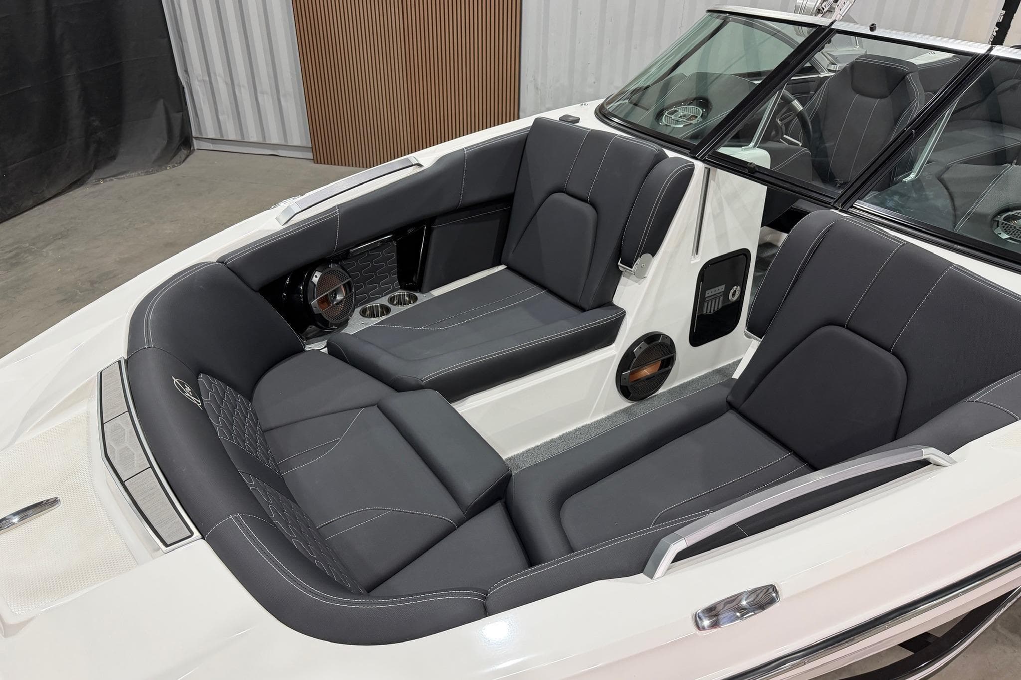 2021 MasterCraft X24 boat interior with sleek black seating and modern design.