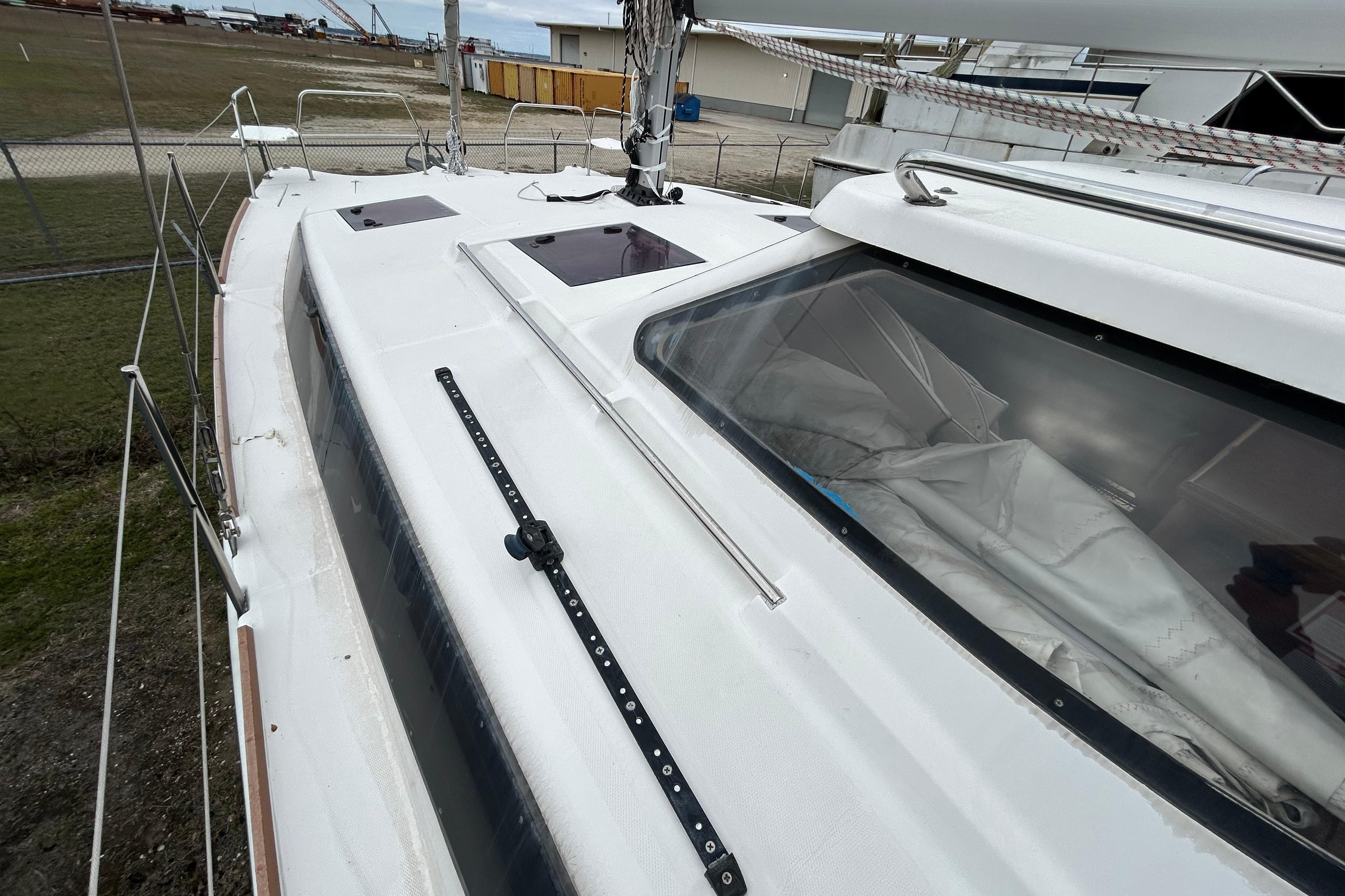 2013 Gemini Legacy 35 sailboat deck with hatches and rigging, docked in a marina.