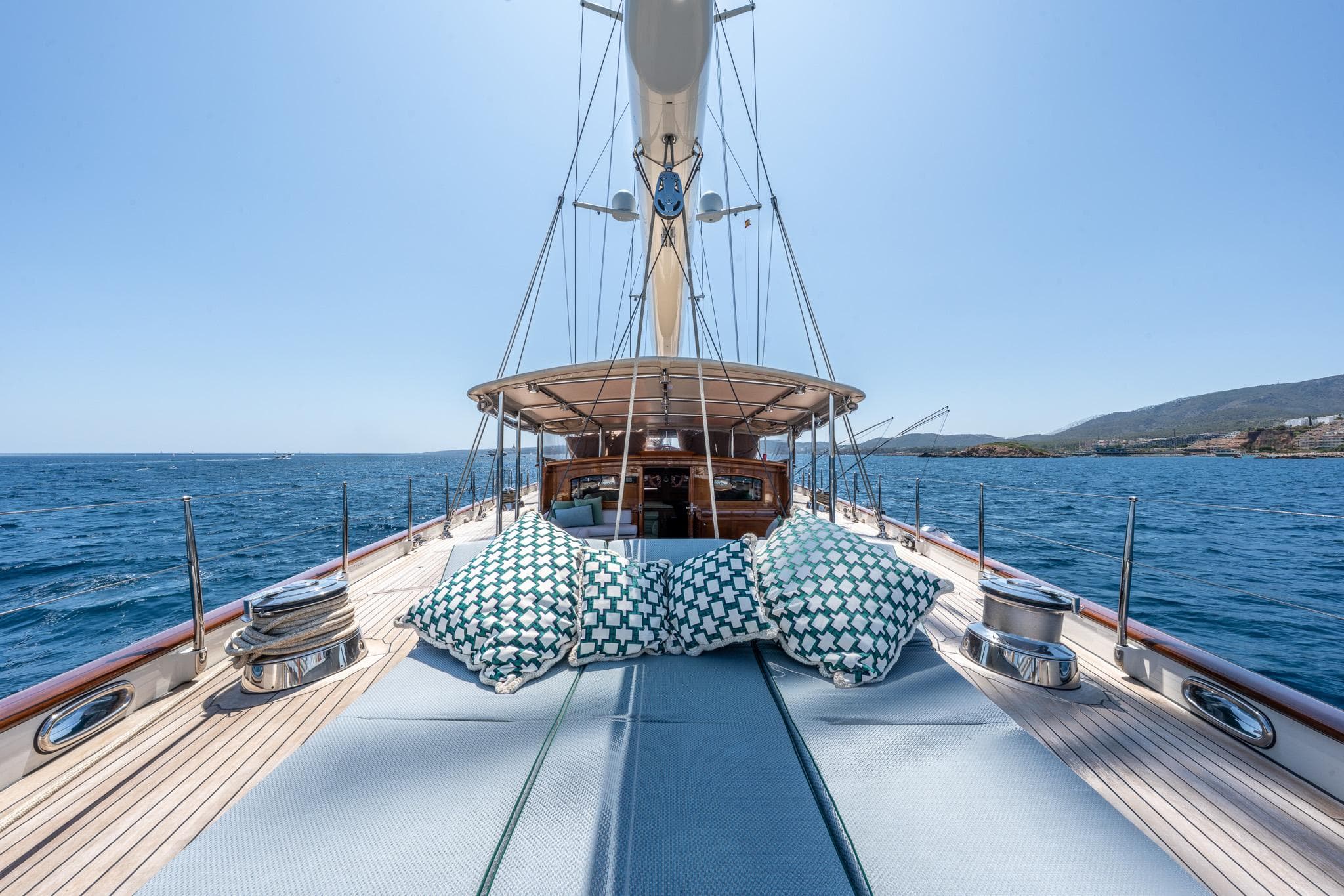 Luxurious 2010 Holland Jachtbouw Classic Schooner deck with cushions, sailing on open sea.