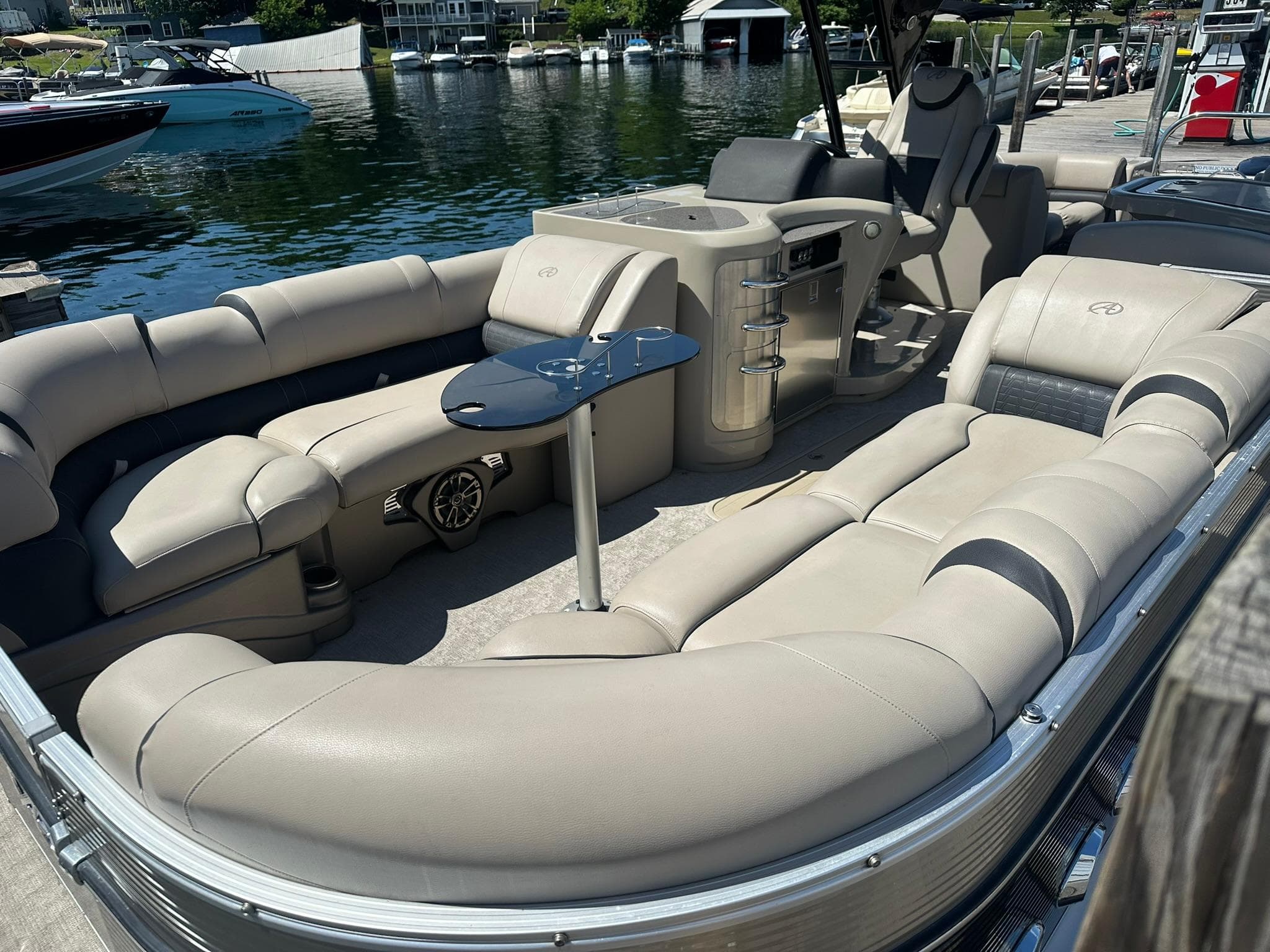2018 Avalon Catalina Platinum Entertainer boat with luxurious seating and sleek design at a dock.
