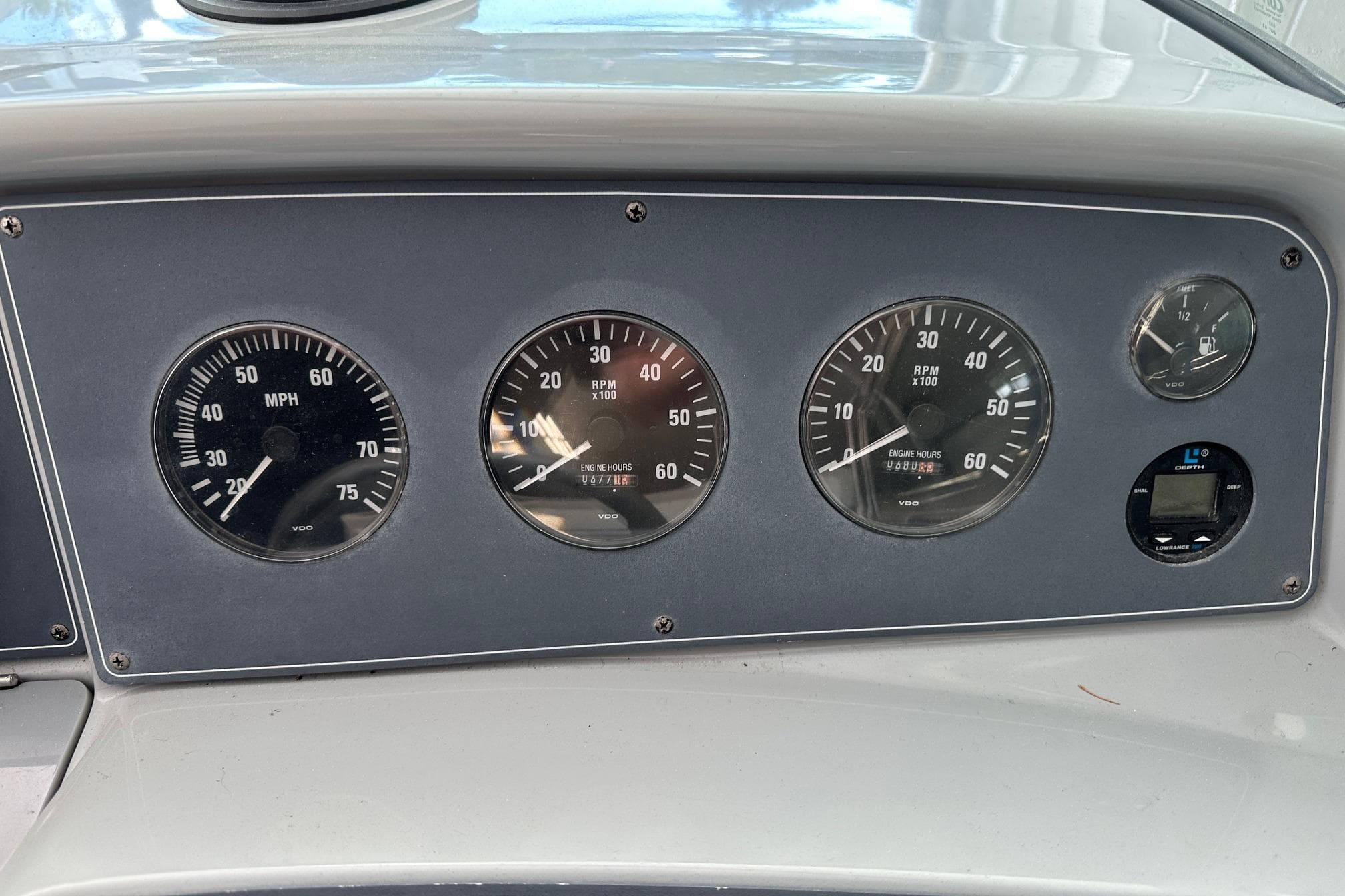 Dashboard of a 1997 Formula 330 Sun Sport boat with speedometer and RPM gauges.