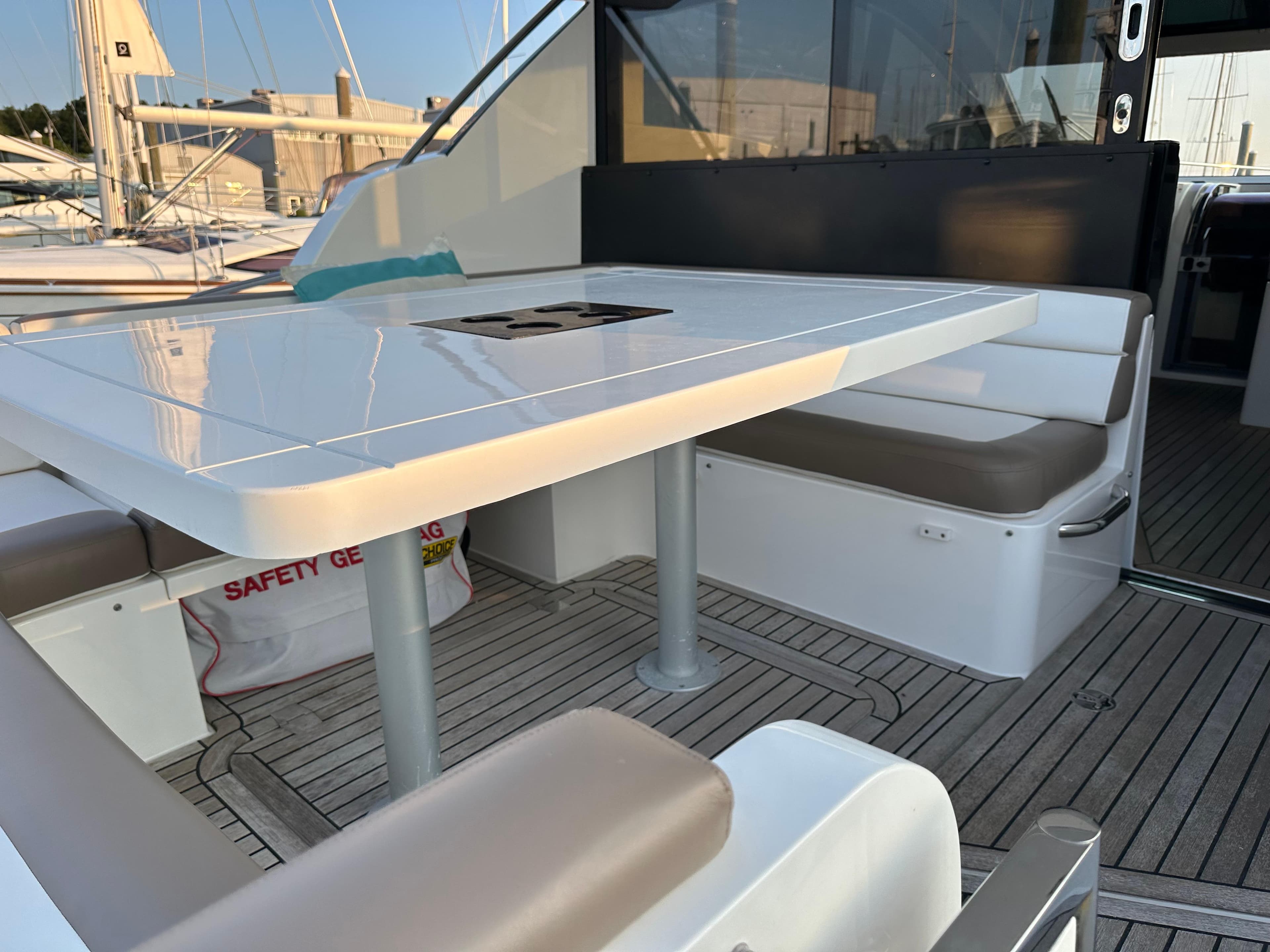 2018 Galeon 485 HTS yacht deck with seating and table, featuring sleek design and modern amenities.