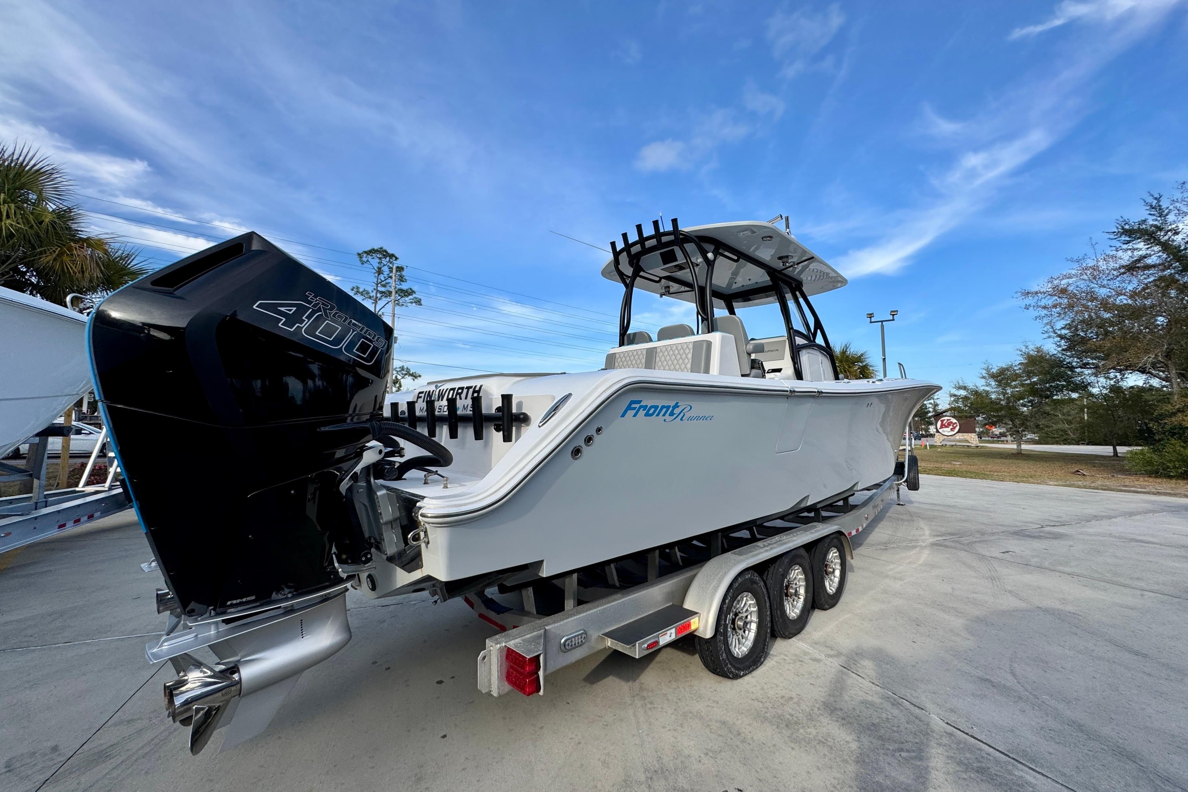 2023 Front Runner 36 Center Console boat on trailer, featuring powerful outboard engine.