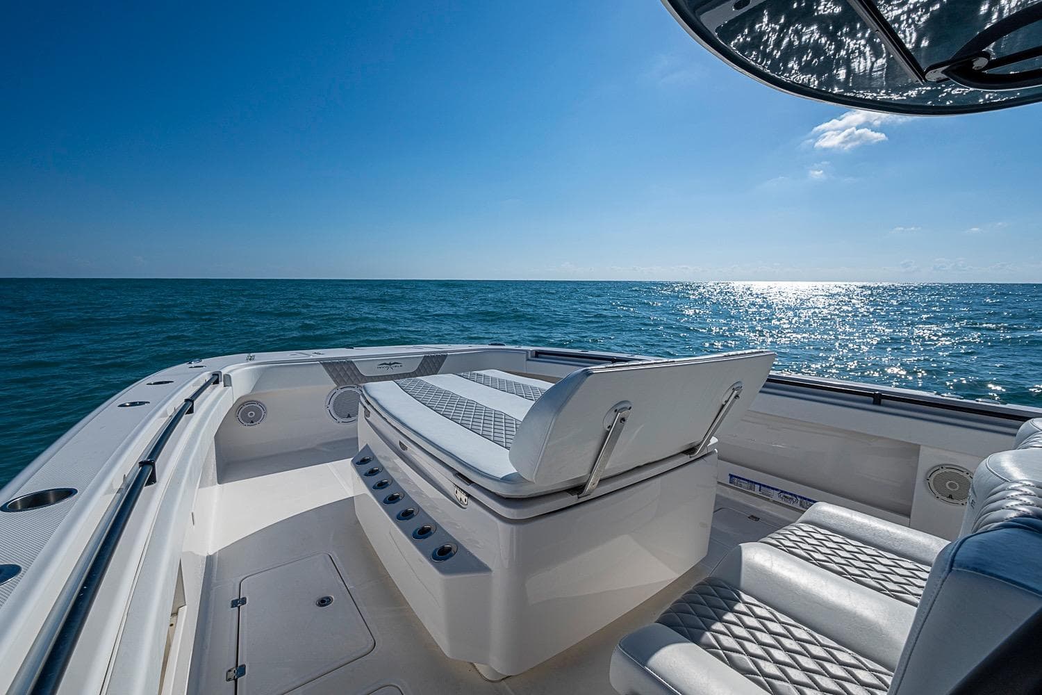 Invincible 40 Catamaran 2018 on open sea, featuring luxurious seating and clear blue skies.