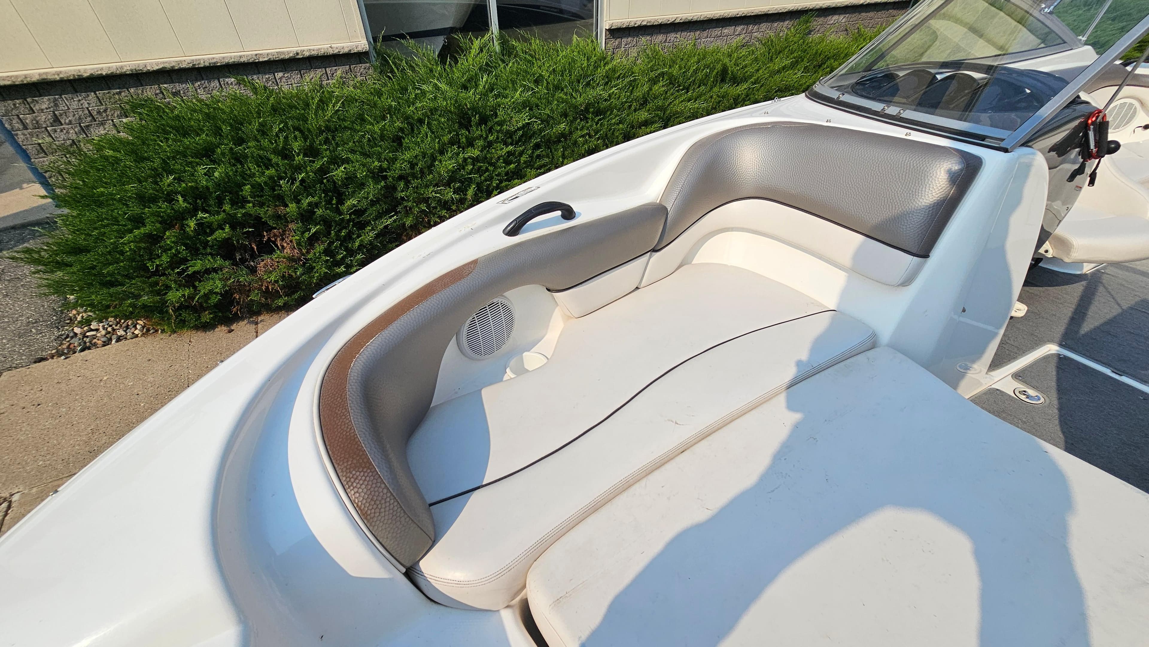 2011 Yamaha SX210 boat interior with cushioned seating and windshield.