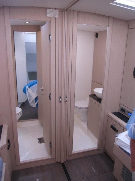 Modern bathroom and cabin interior of 2024 Jeanneau 60 yacht.