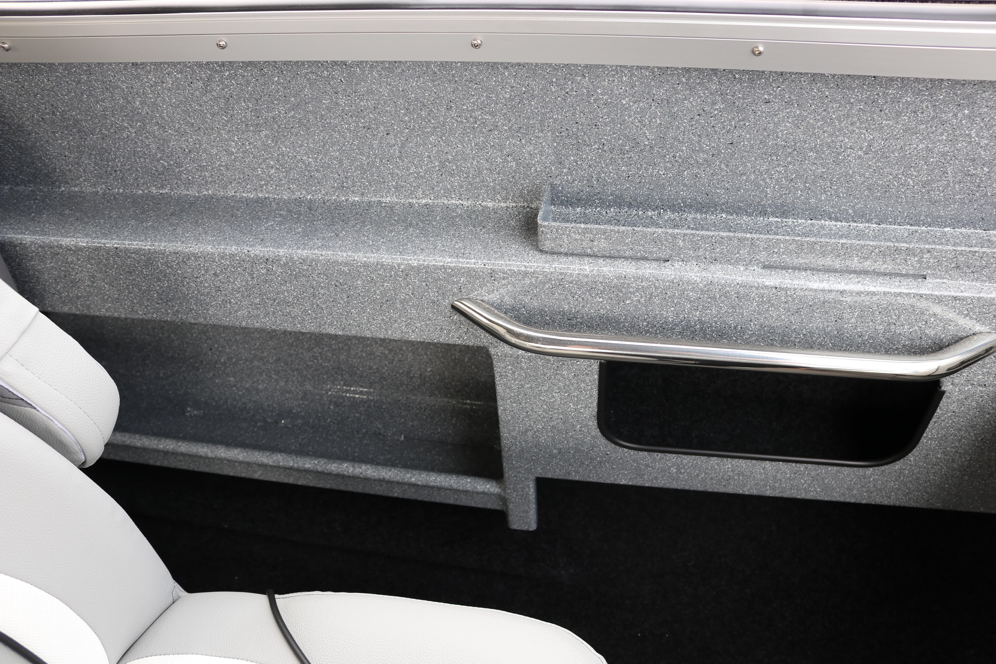 Interior view of 2026 KingFisher 2425 Escape HT boat, featuring sleek seating and storage.