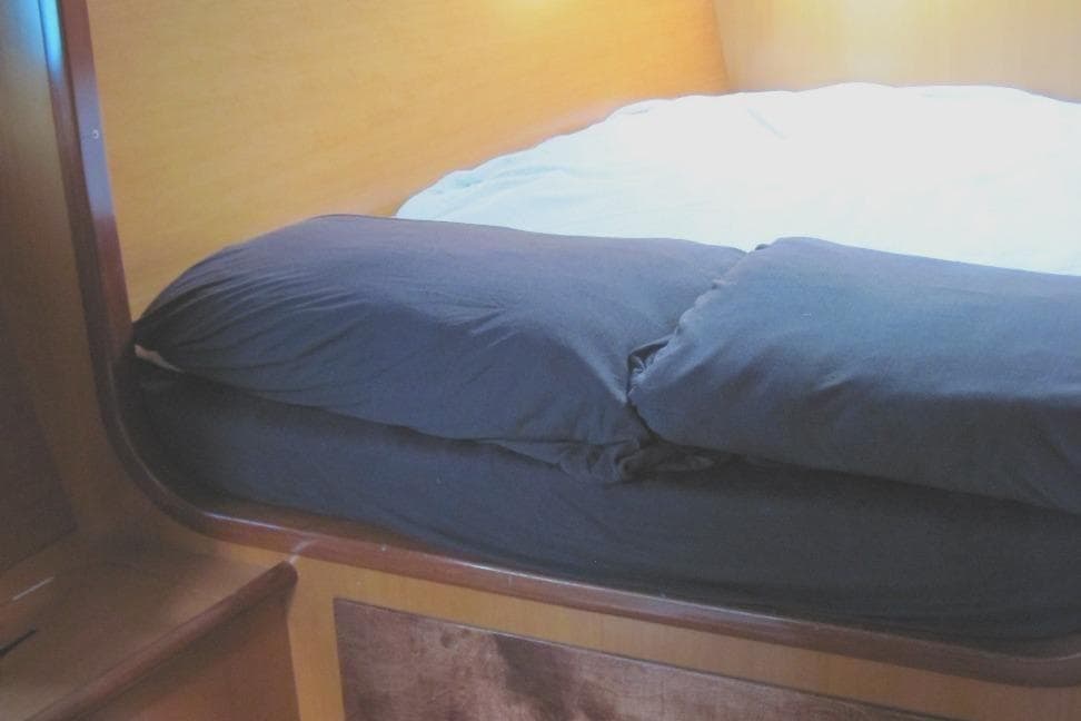 Cozy cabin bed in 1997 Lagoon 410 yacht interior.
