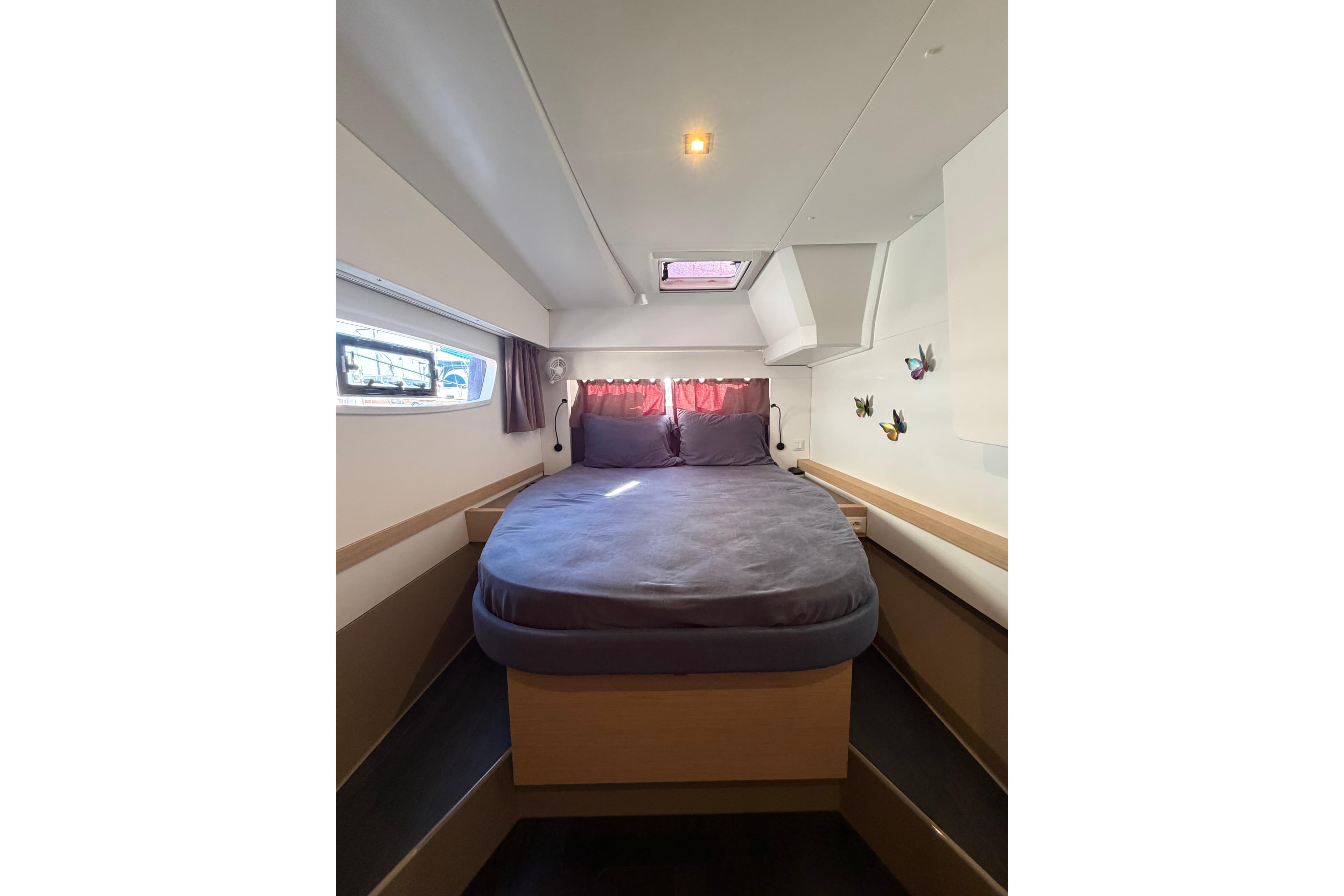2024 Fountaine Pajot Astrea 42 Catamaran cabin with cozy bed and modern decor.