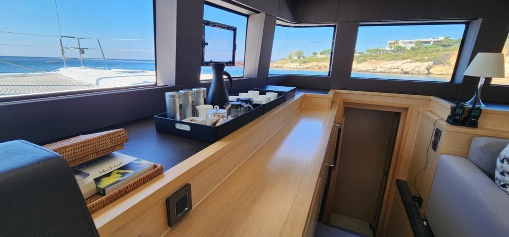 Interior of 2017 Lagoon 620 Essence yacht with ocean view and modern amenities.