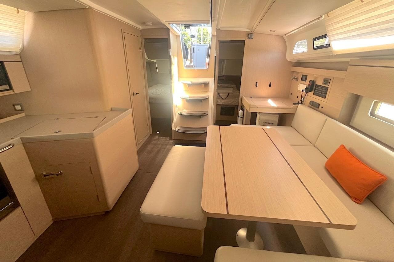 Modern interior of 2022 Beneteau Oceanis 40.1 yacht with light wood finishes.