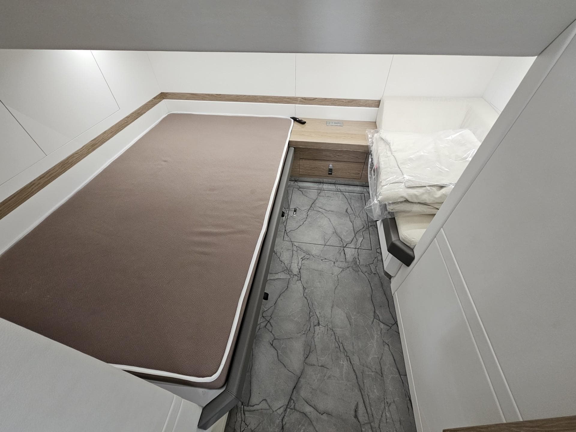 Luxurious cabin interior of 2024 Rio Yachts Daytona 50 with modern design and comfortable bedding.