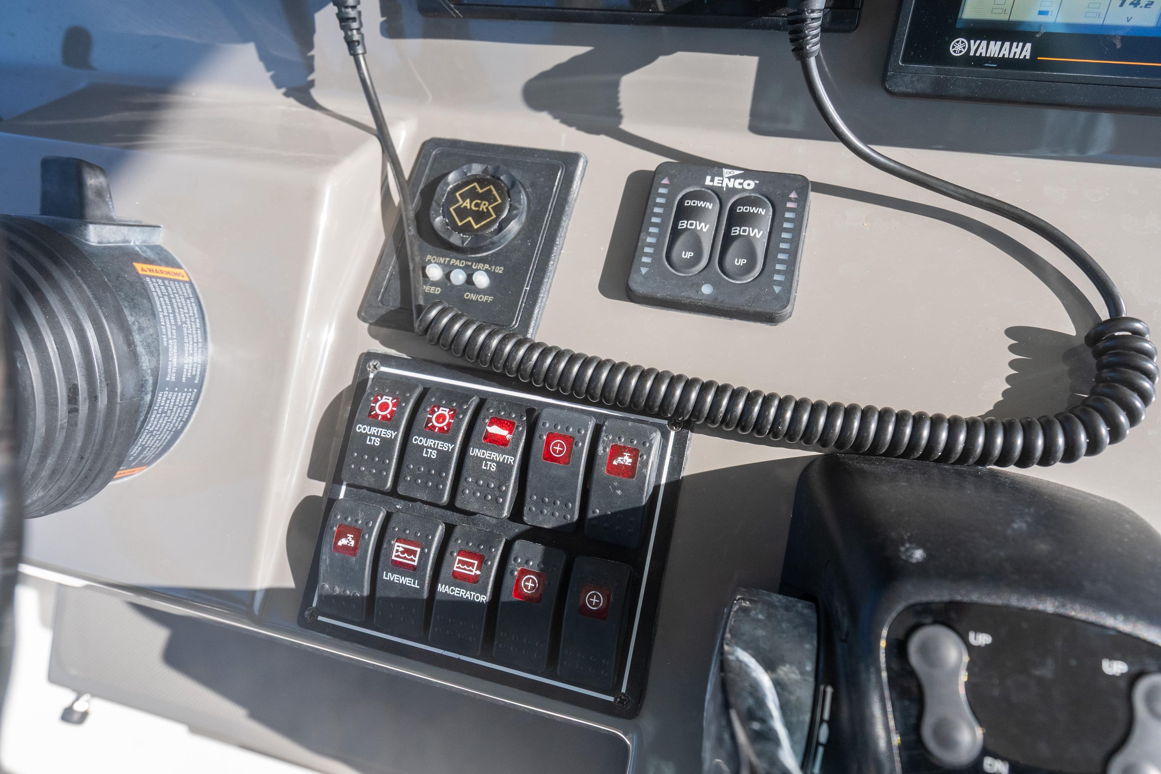 Control panel of 2018 Pursuit S 328 Sport boat with switches and controls.