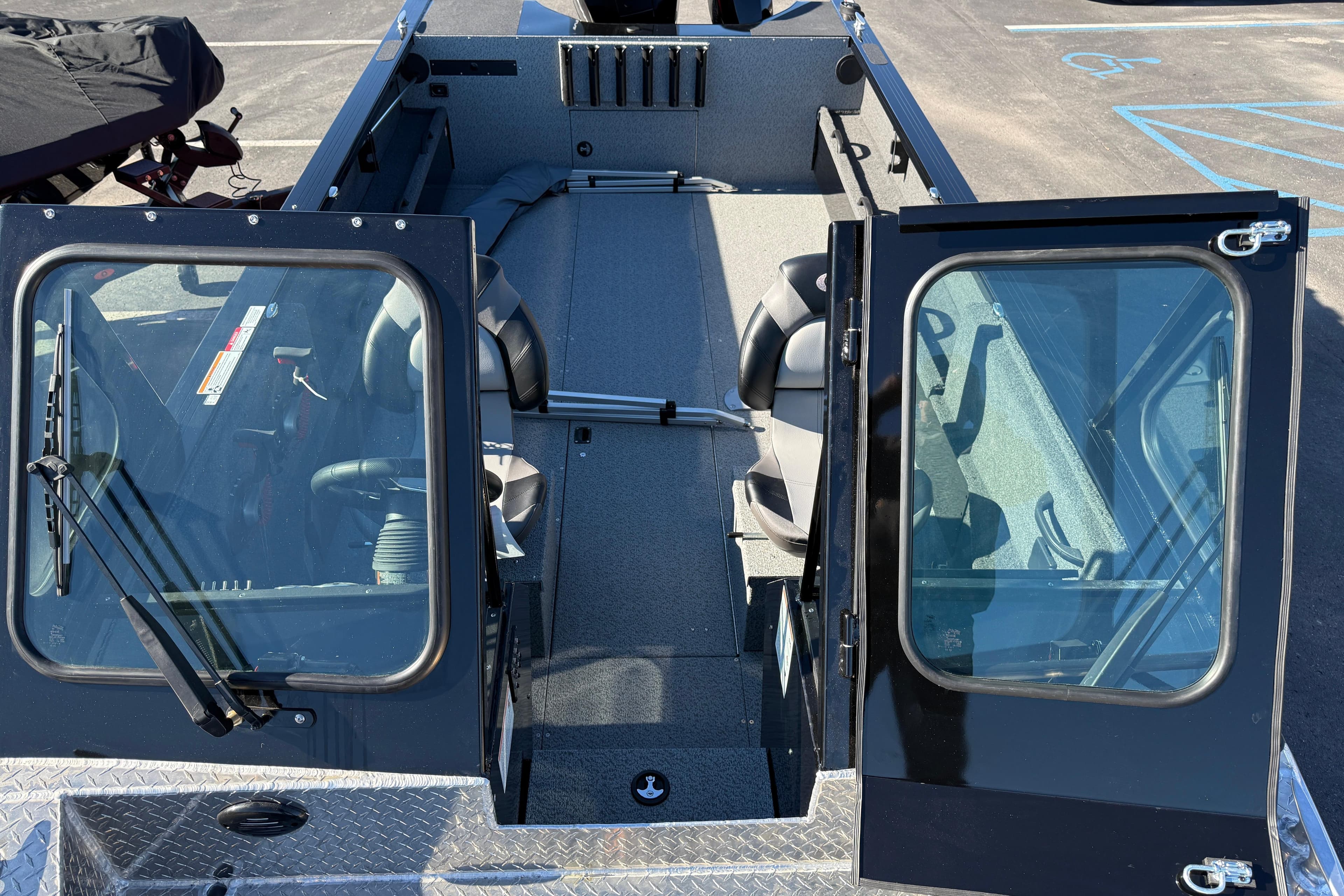 2026 Crestliner 2050 Commander Elite boat interior with open doors and seating.