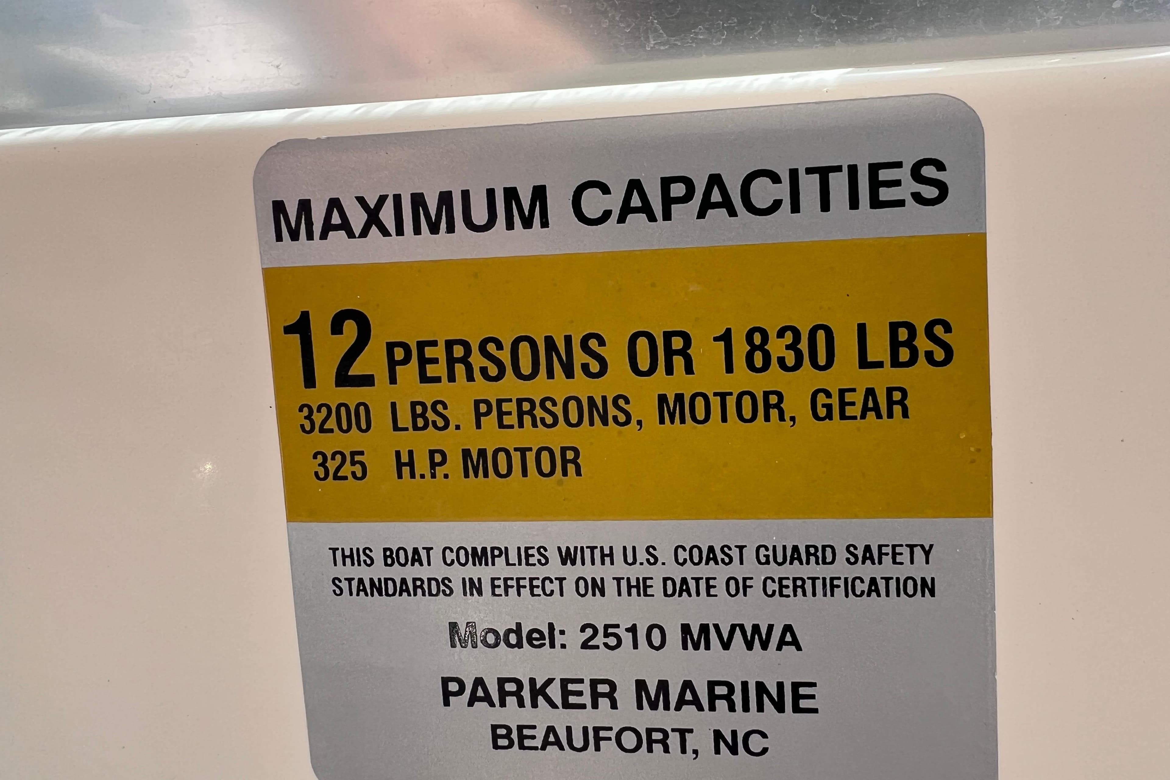 Maximum capacity label on 2005 Parker 2510 Walkaround boat, 12 persons or 1830 lbs.