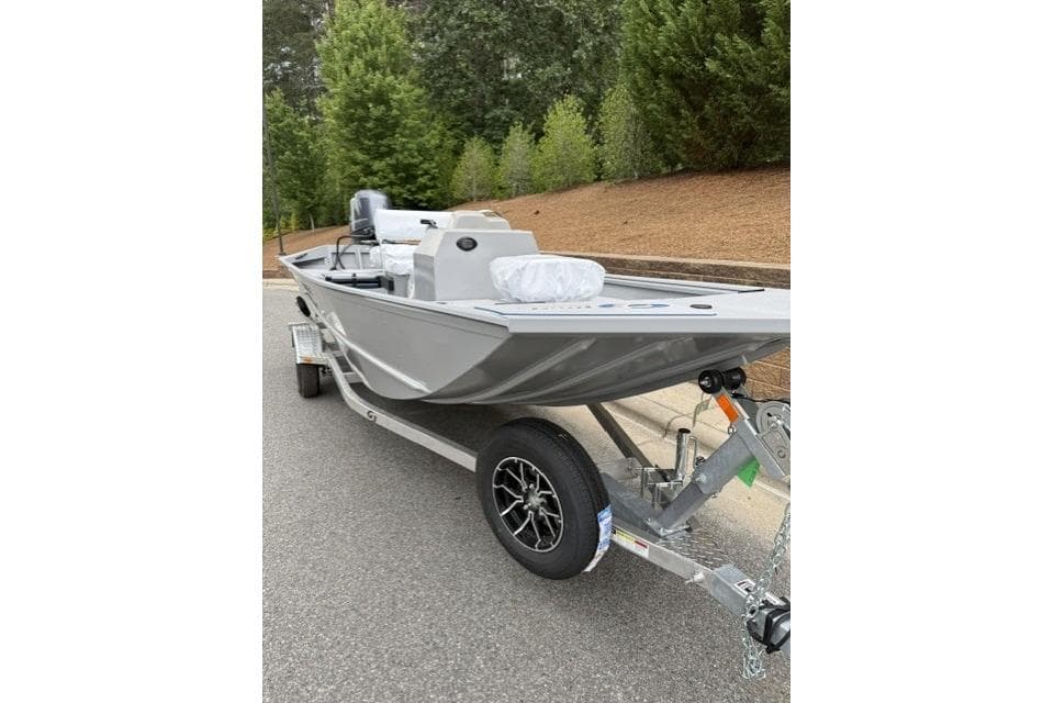 2026 G3 Gator Tough 18 CCJ boat on trailer, parked on roadside.