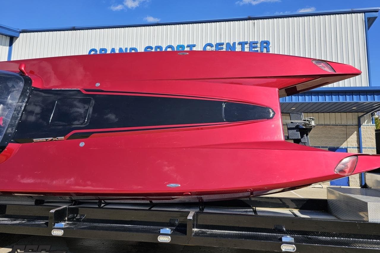 Red 2010 MTI 44 Corvette boat at Grand Sport Center, viewed from above.