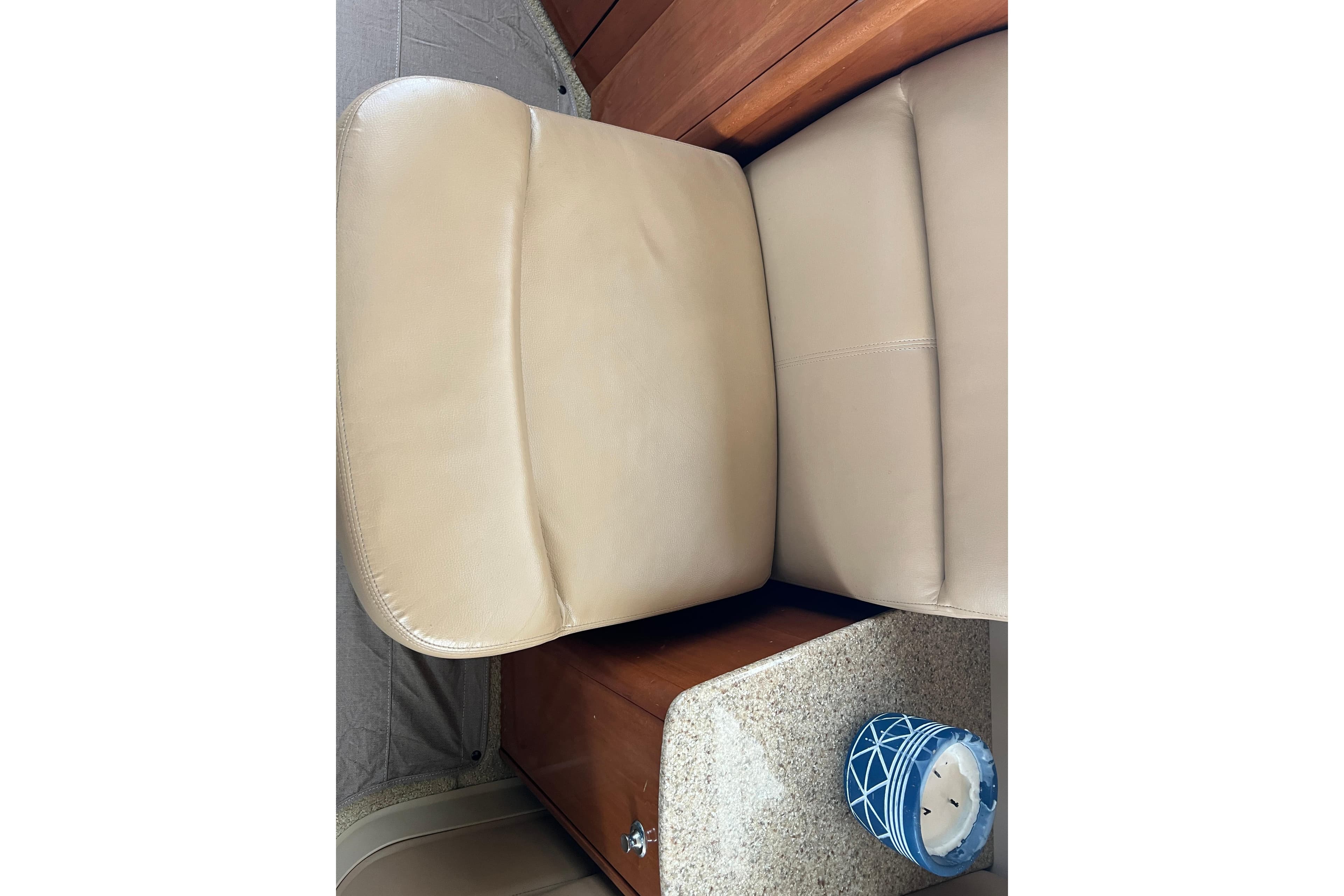 Beige leather seating in 2007 Meridian 391 Sedan interior with blue decorative candle.