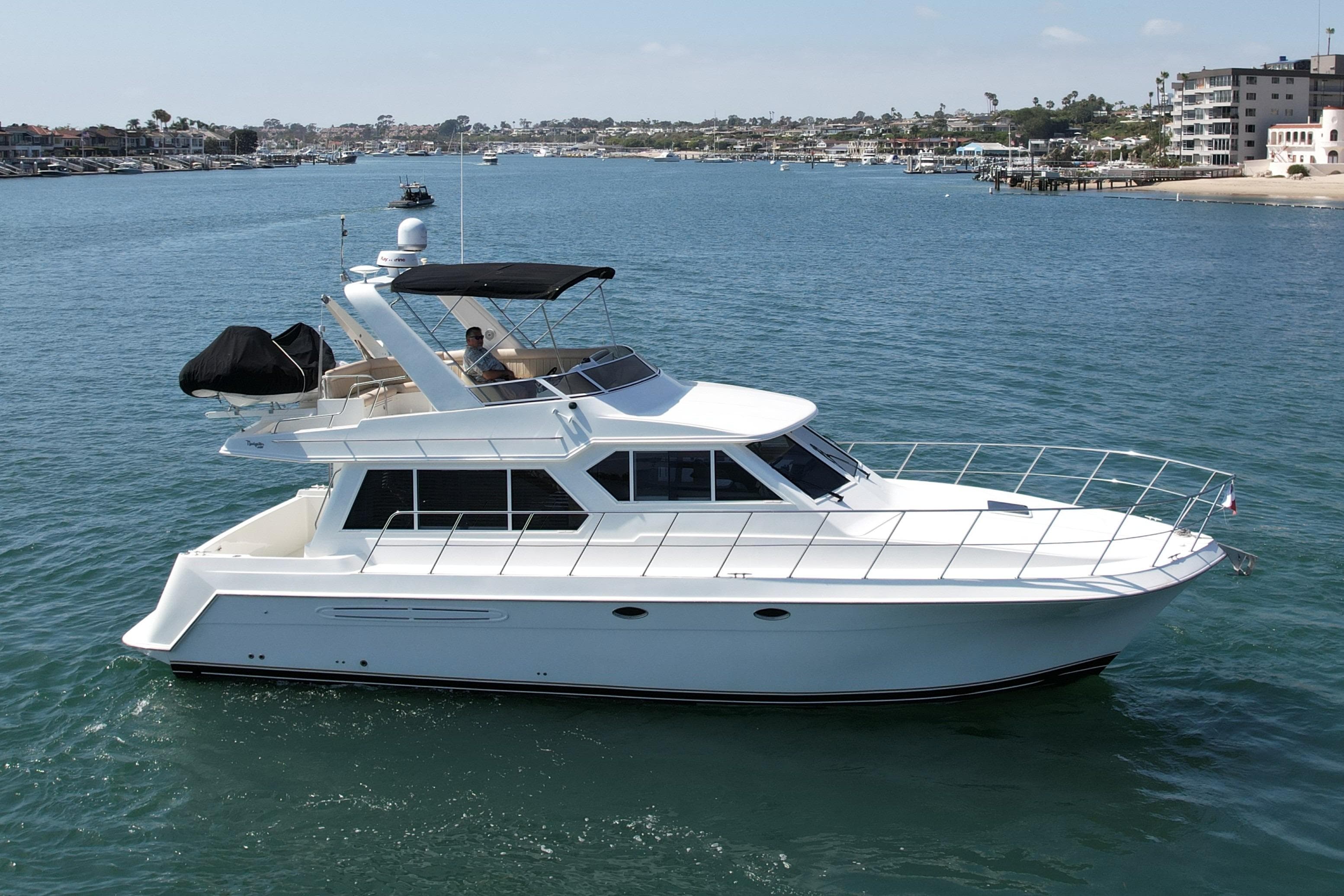 2007 Navigator 44 Classic yacht cruising in a scenic coastal area.