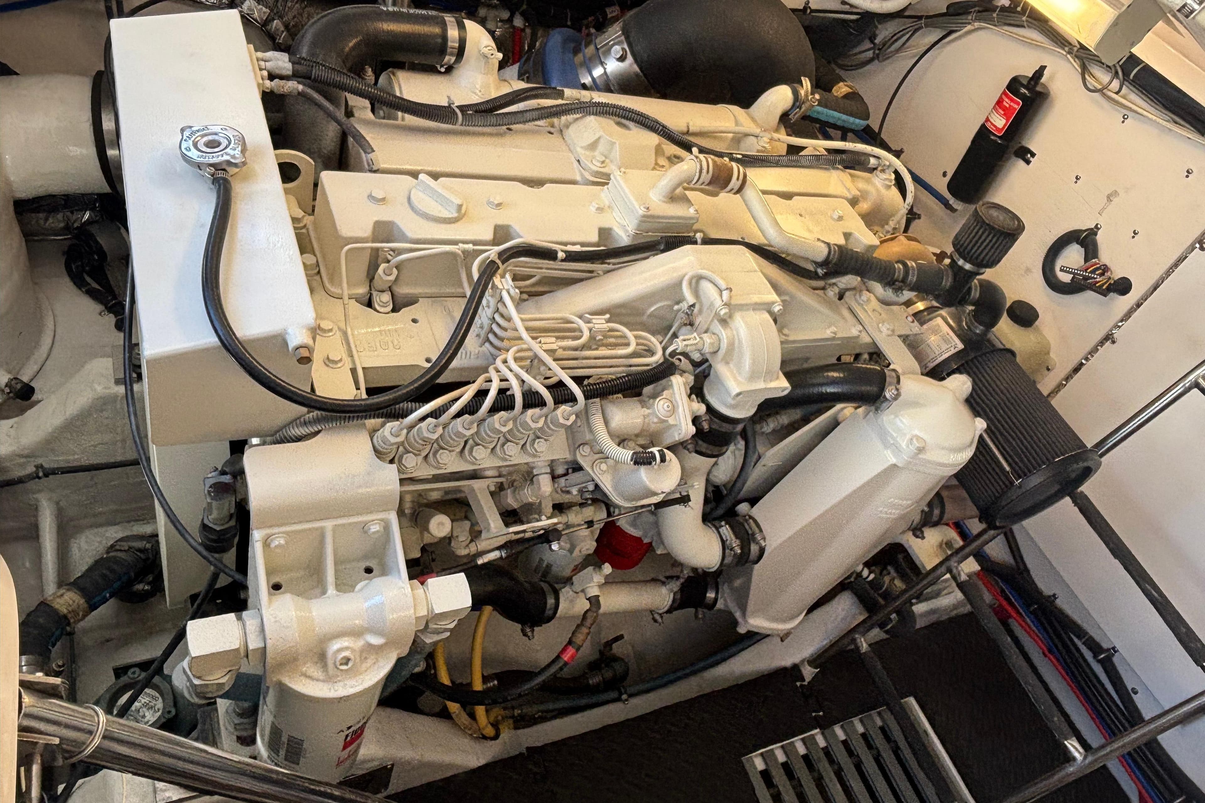 Engine compartment of a 2004 Tiara Yachts 3600 Sovran, showcasing detailed mechanical components.