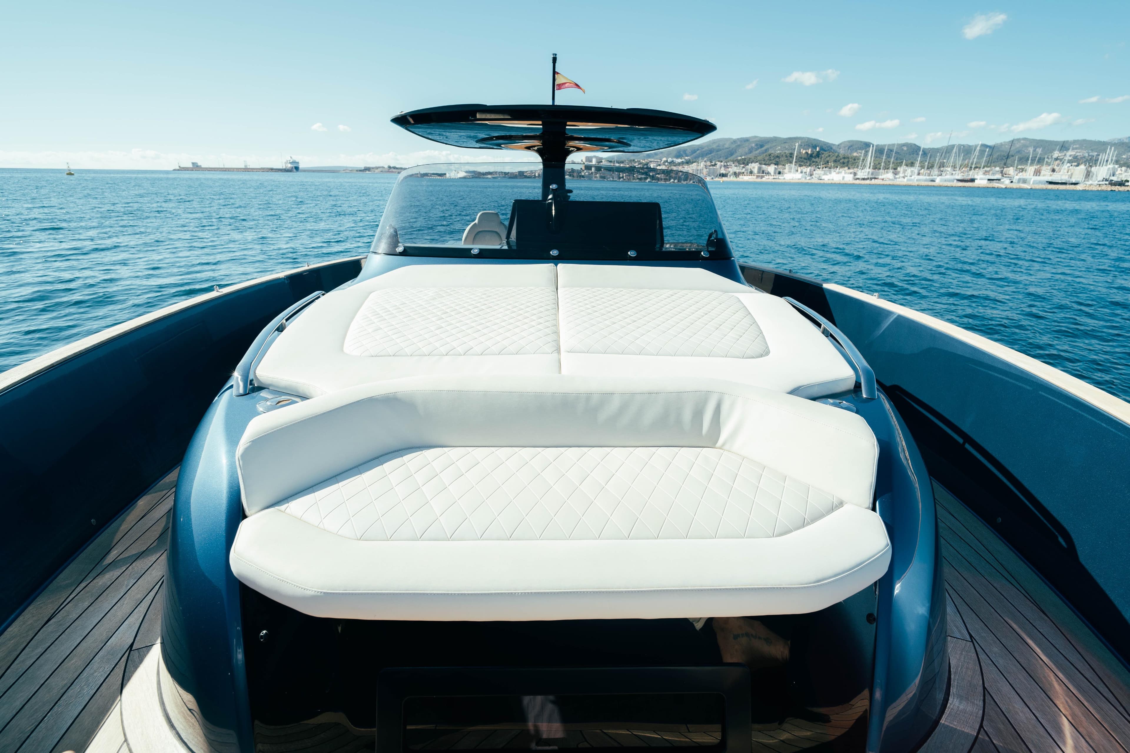 2023 Solaris Power 44 Open yacht with luxurious deck seating on calm waters.