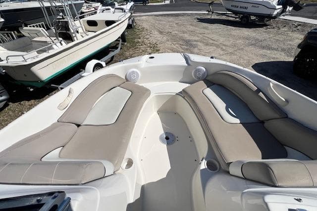 2004 Sea Ray 220 Sundeck boat with spacious seating and modern design.