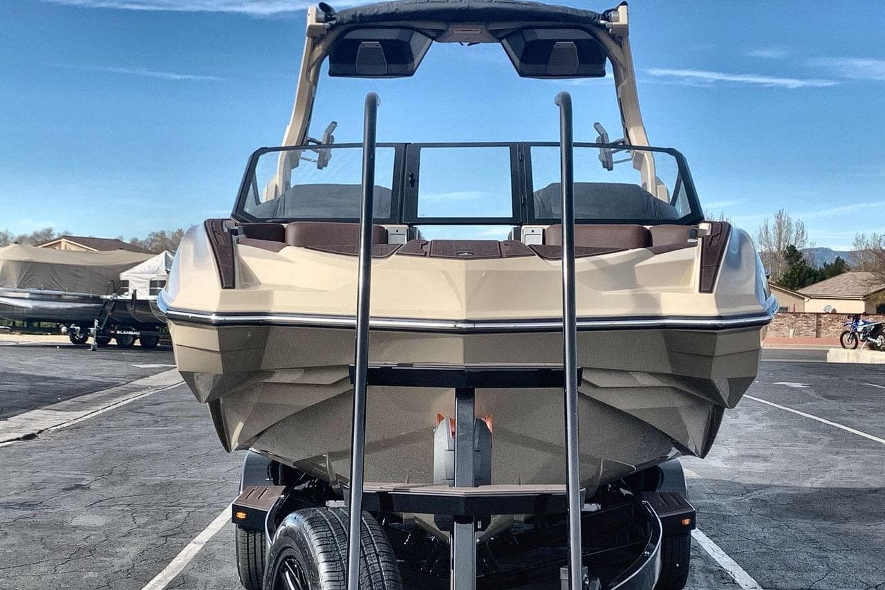 2026 Supra SE 550 boat on trailer, showcasing sleek design and modern features.
