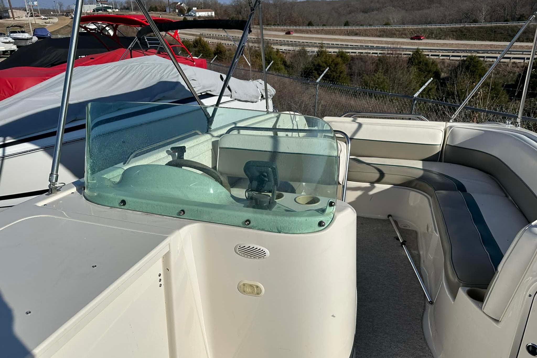1998 Bayliner 2659 Rendezvous boat interior with steering console and seating area.
