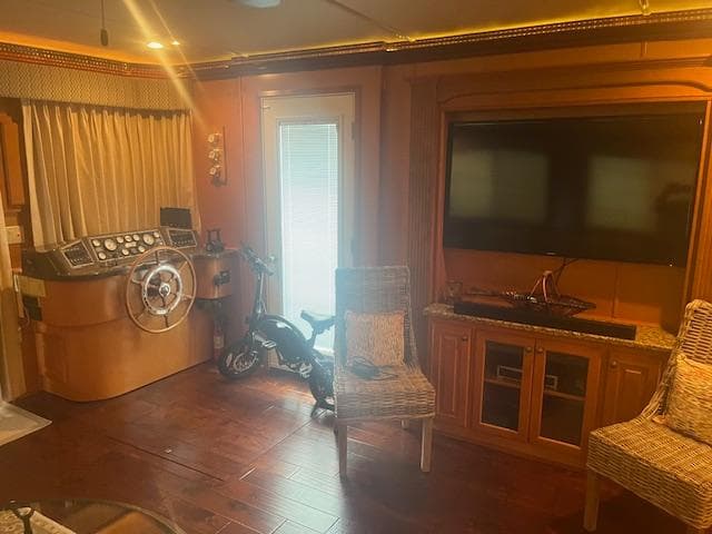Interior of 2009 Horizon 18 x 85 Houseboat with helm, TV, and seating area.