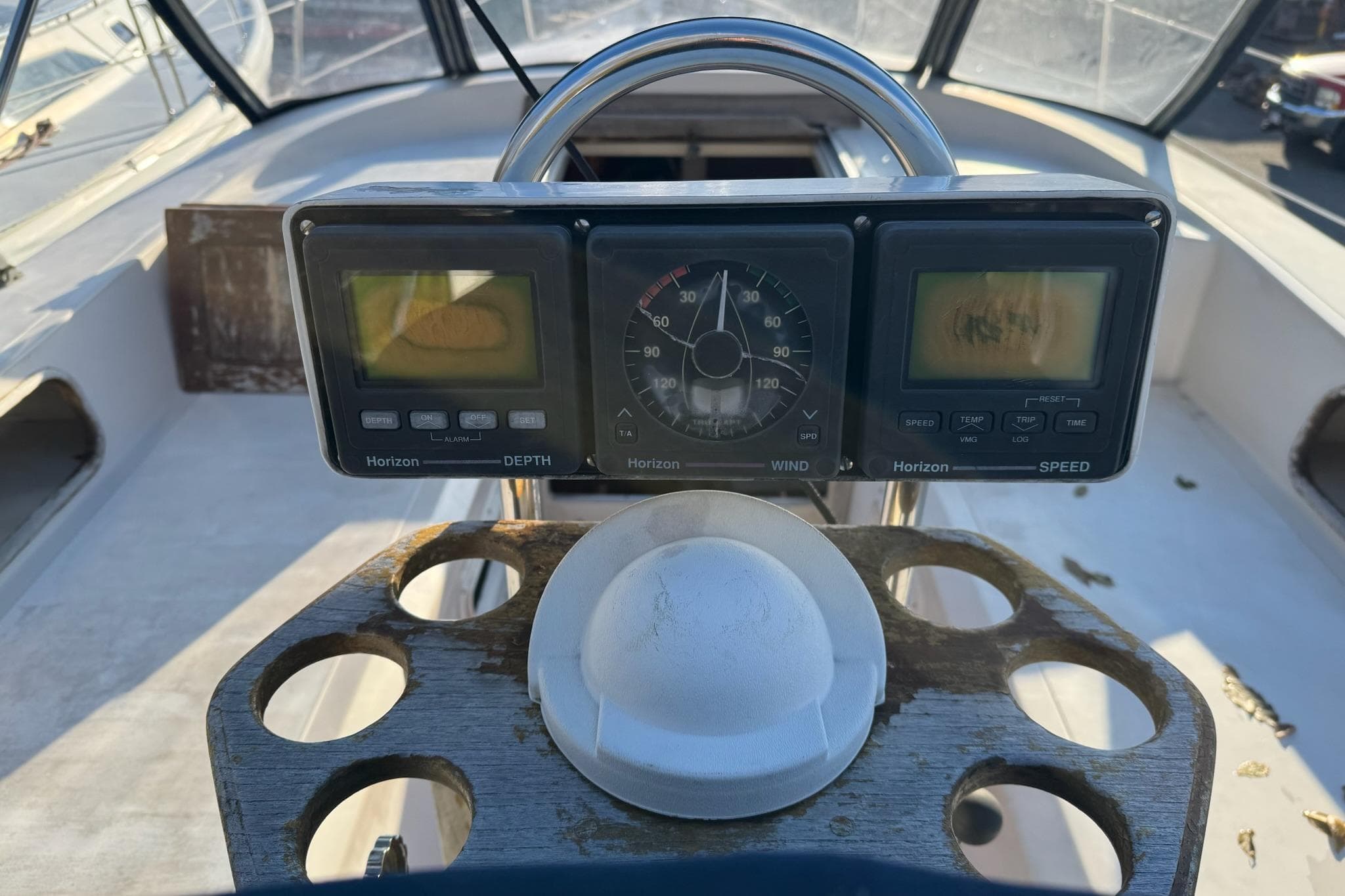 Cockpit of 1987 Irwin 38 Mk II sailboat with navigation instruments and steering wheel.