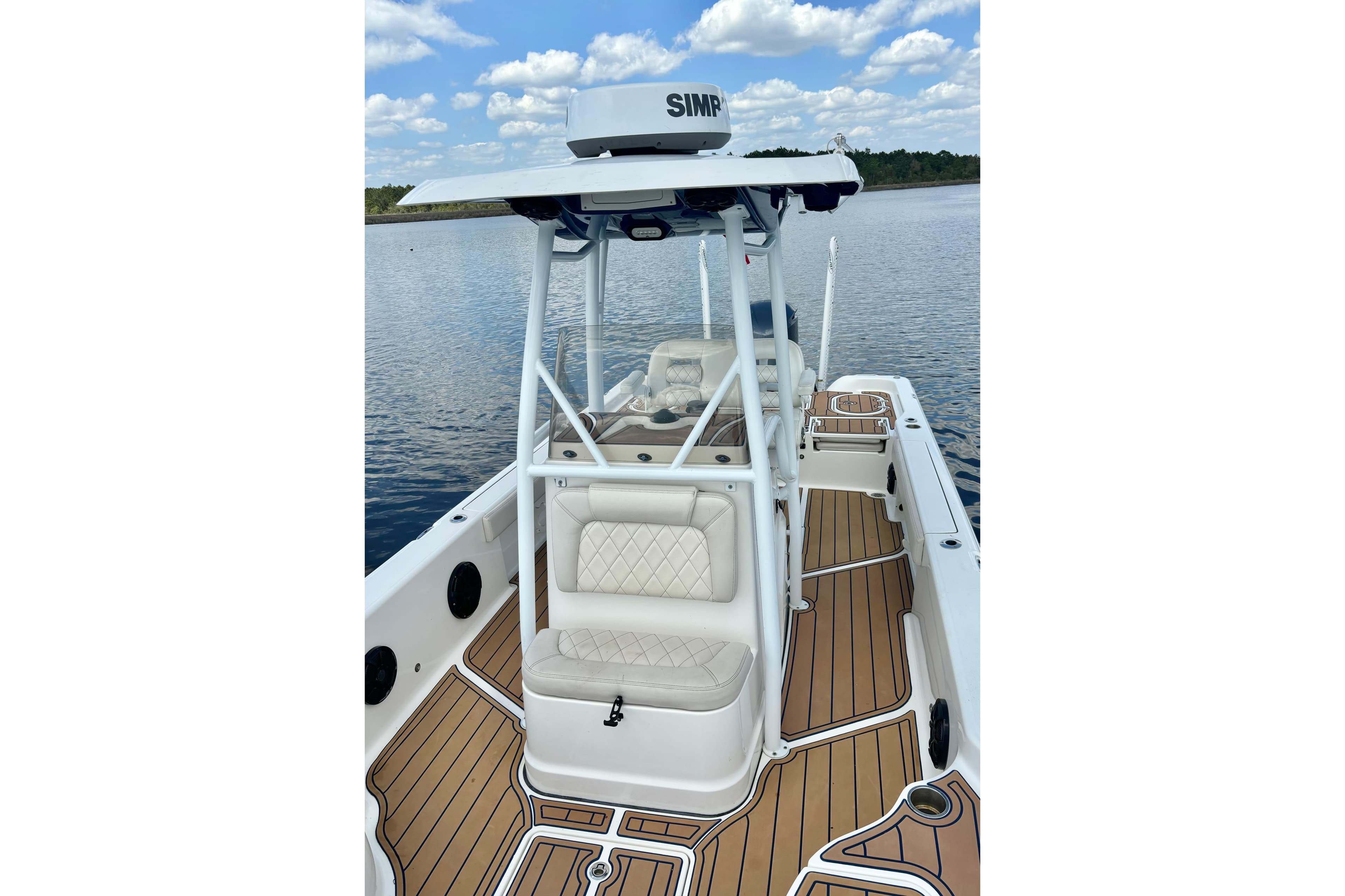 2021 Blue Wave 2600 PureBay boat with sleek design on calm water.