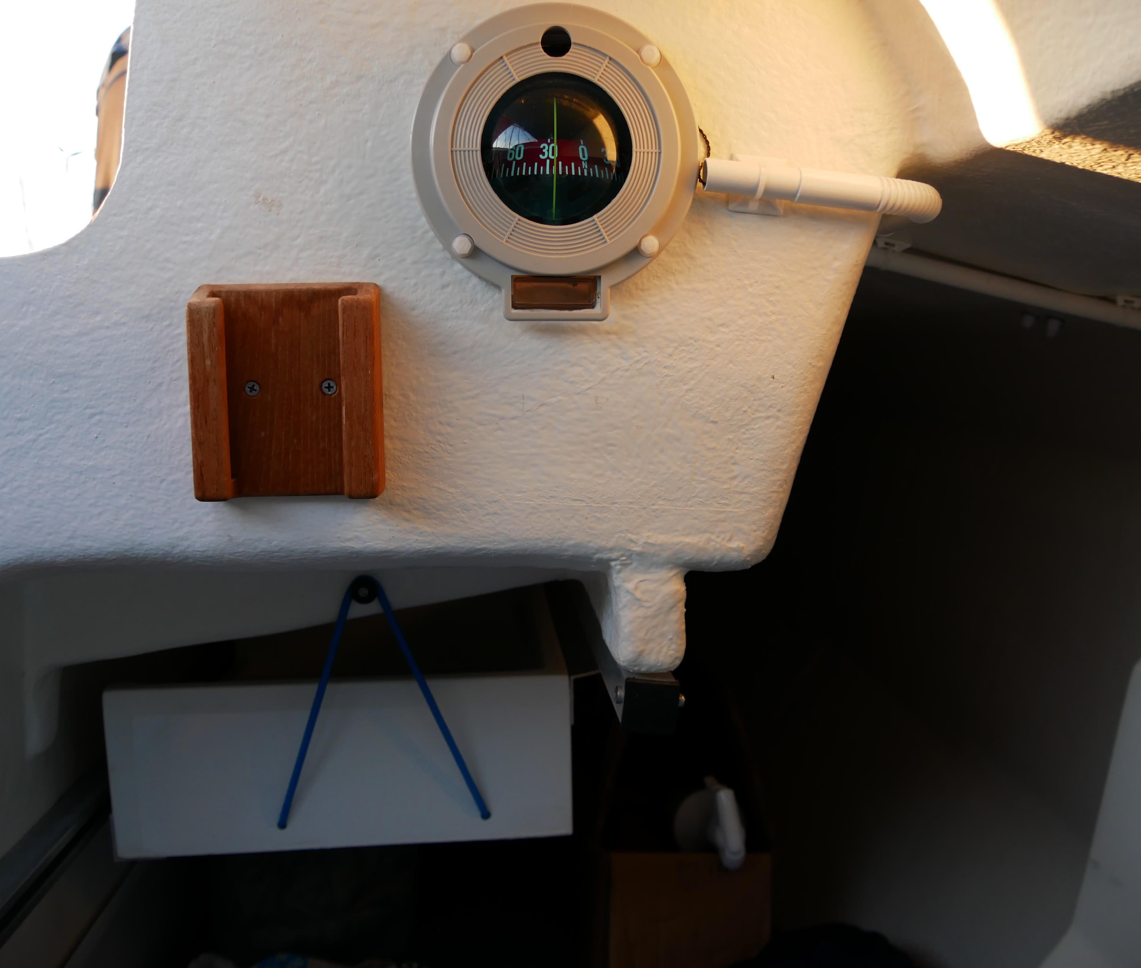 Interior of a 2016 Bente 24 sailboat featuring a compass and wooden fixture.