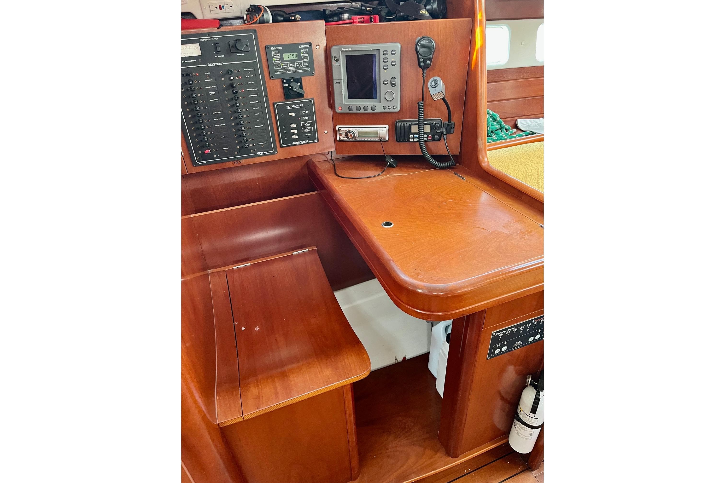 2006 Beneteau Oceanis Clipper 423 navigation station with control panel and communication equipment.